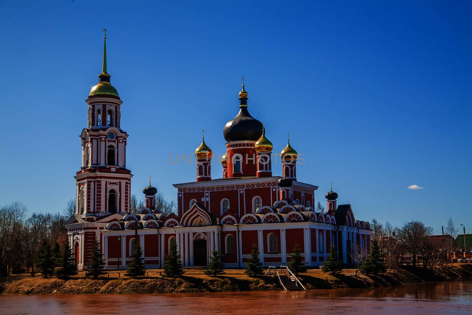 Russian orthodox church on the bank of a river in Staraya Russa