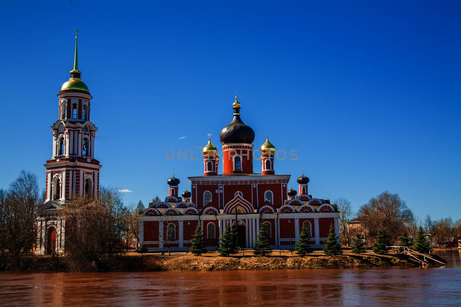 Russian orthodox church on the bank of a river in Staraya Russa