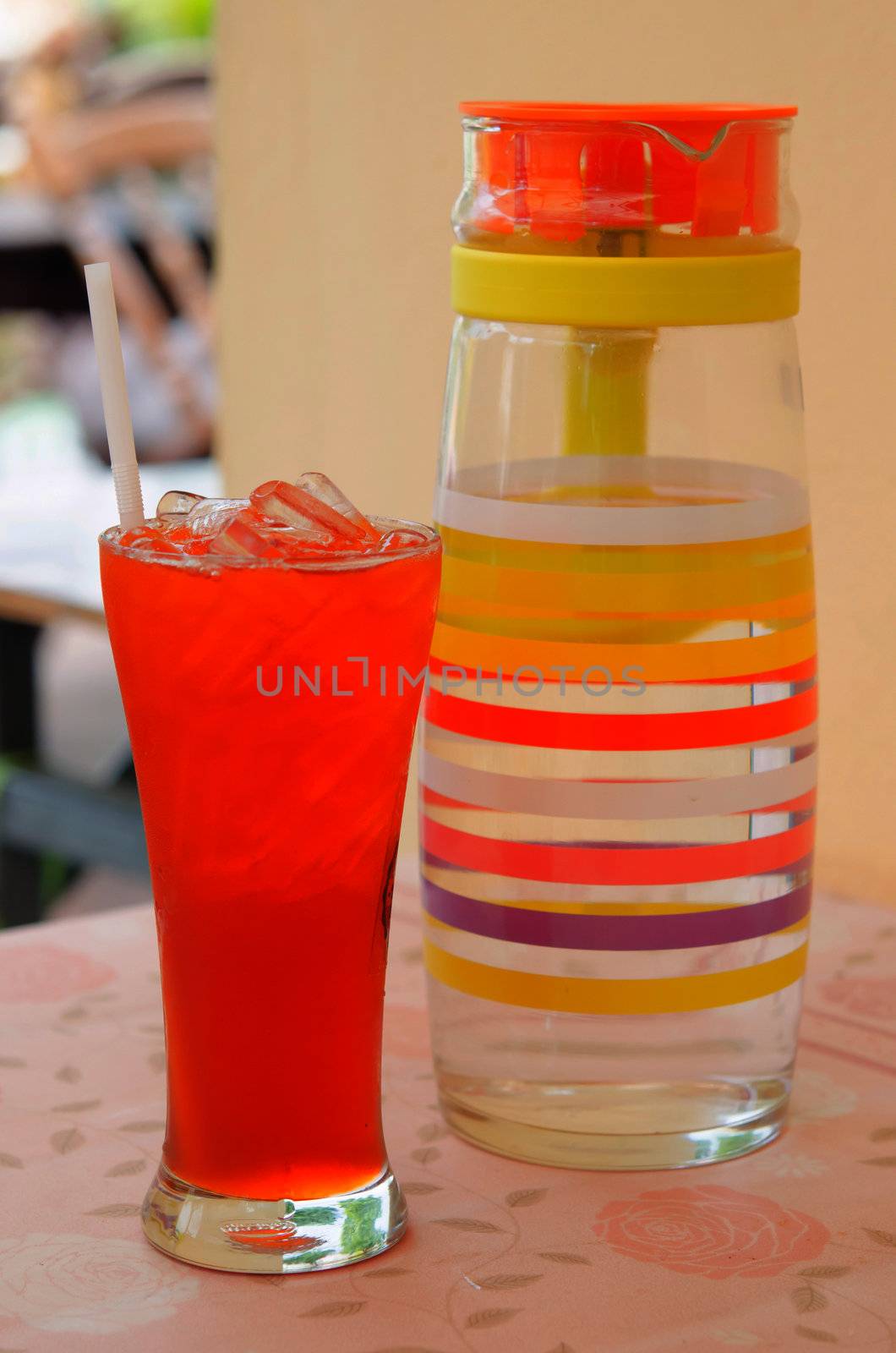 Refreshing glass of iced tea on table