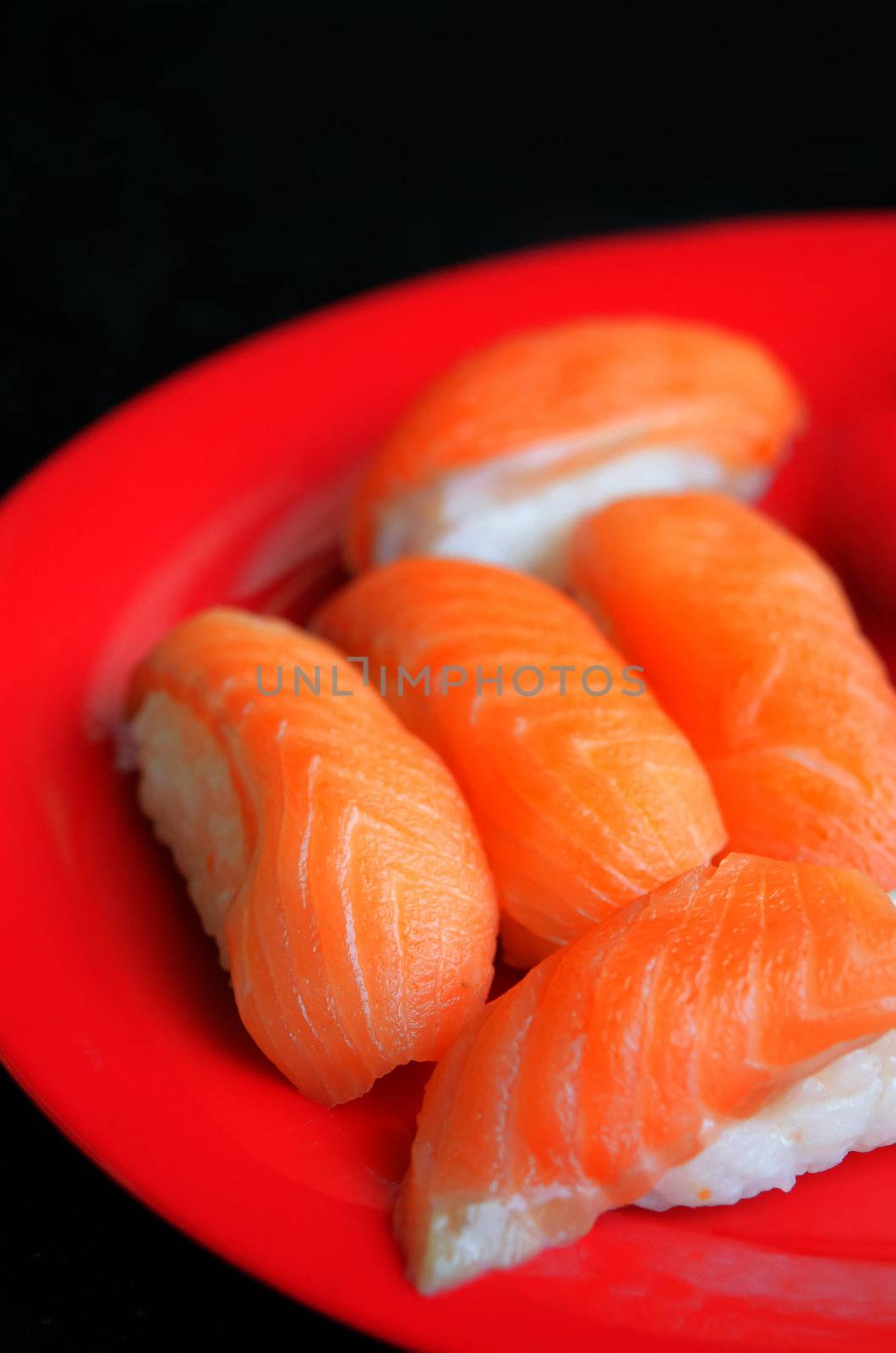 close up salmon sushi on dish , japanese style cuisine