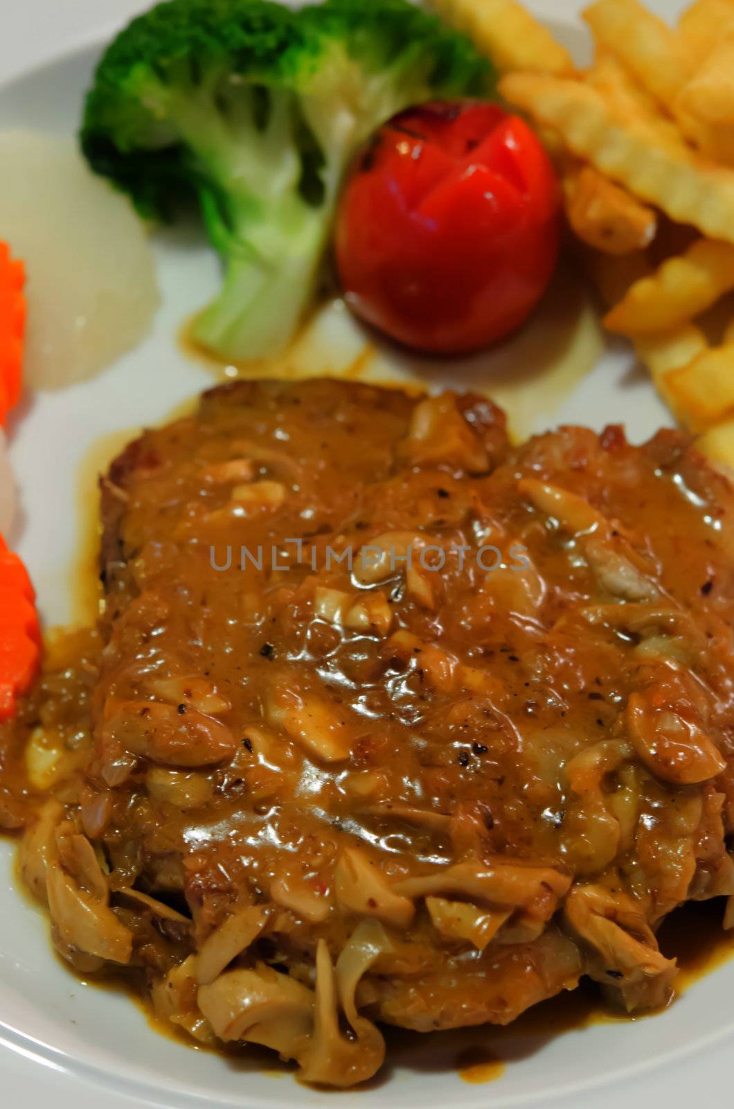 close up beef steak with vegetable and   french fries