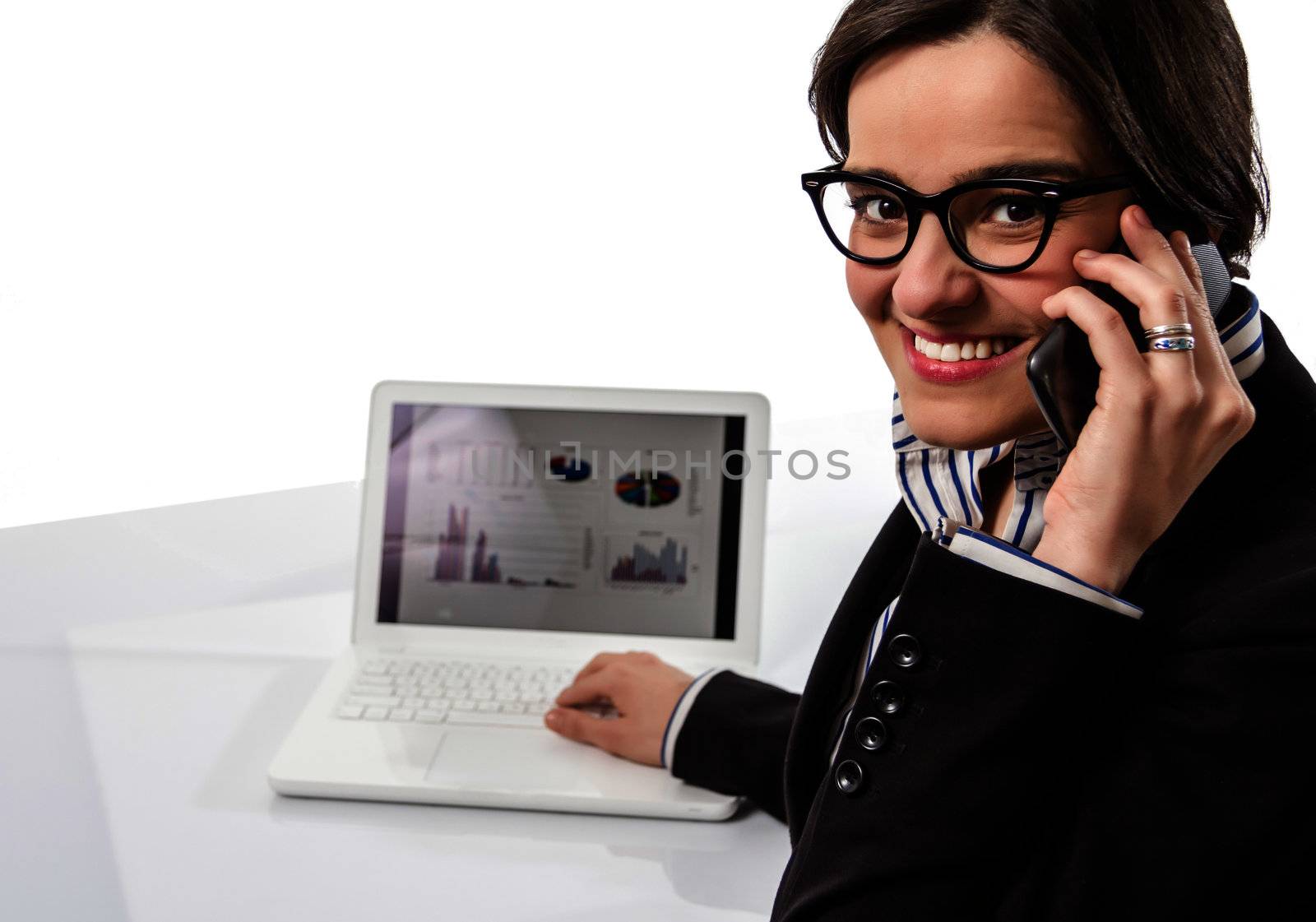 Young executive woman with glasses working on laptop computer and calling by the smartphone, over a white backgroud