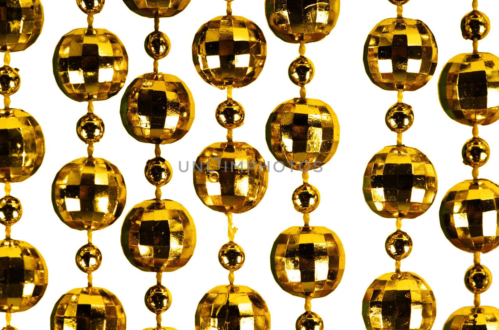 Background made of a brilliant celebratory beads of golden color