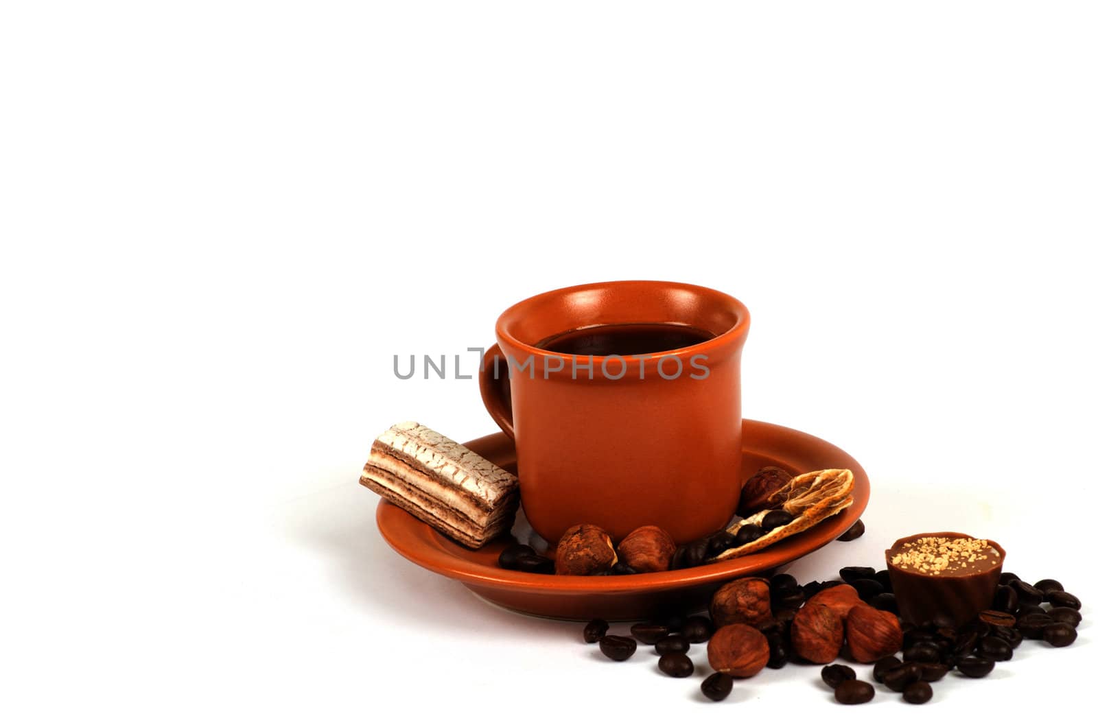Cup of coffee with ingredients on a white background