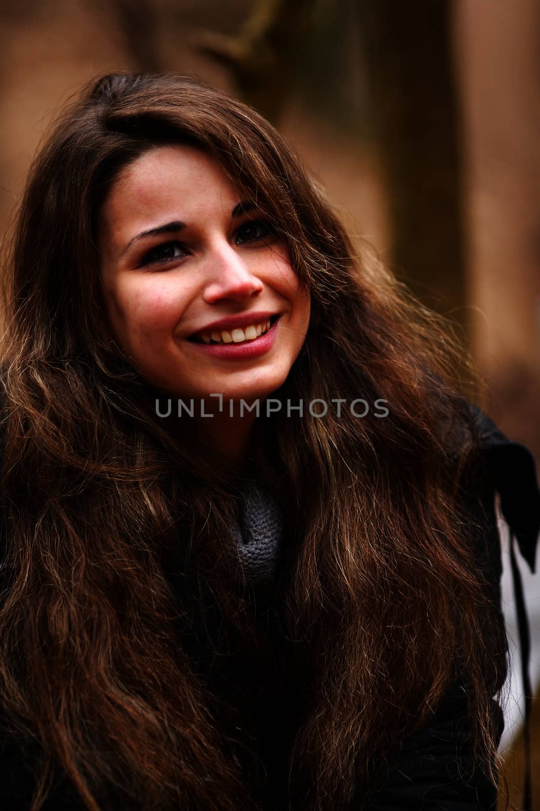 Happy girl smiling outdoors