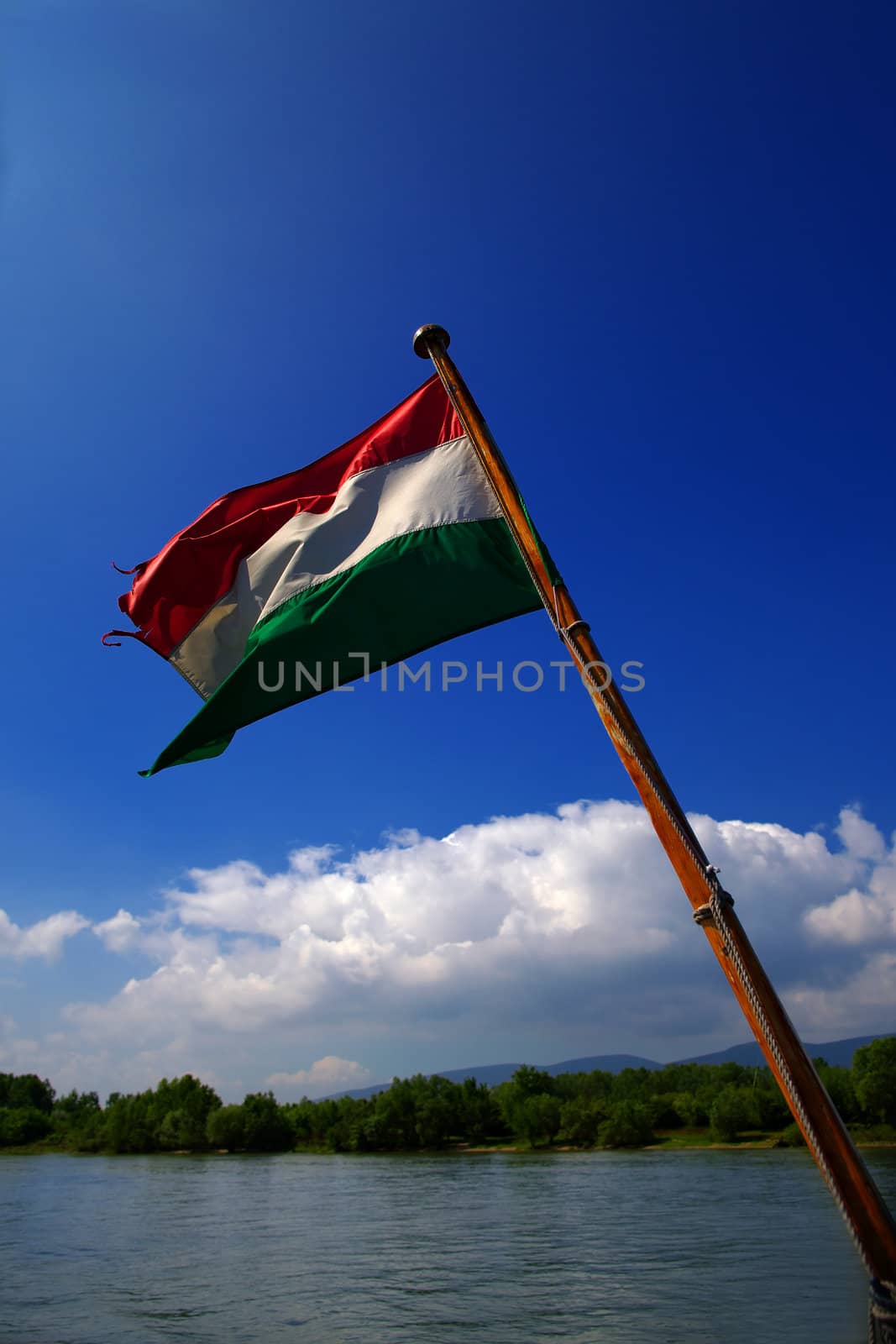 Hungarian national flag over a river