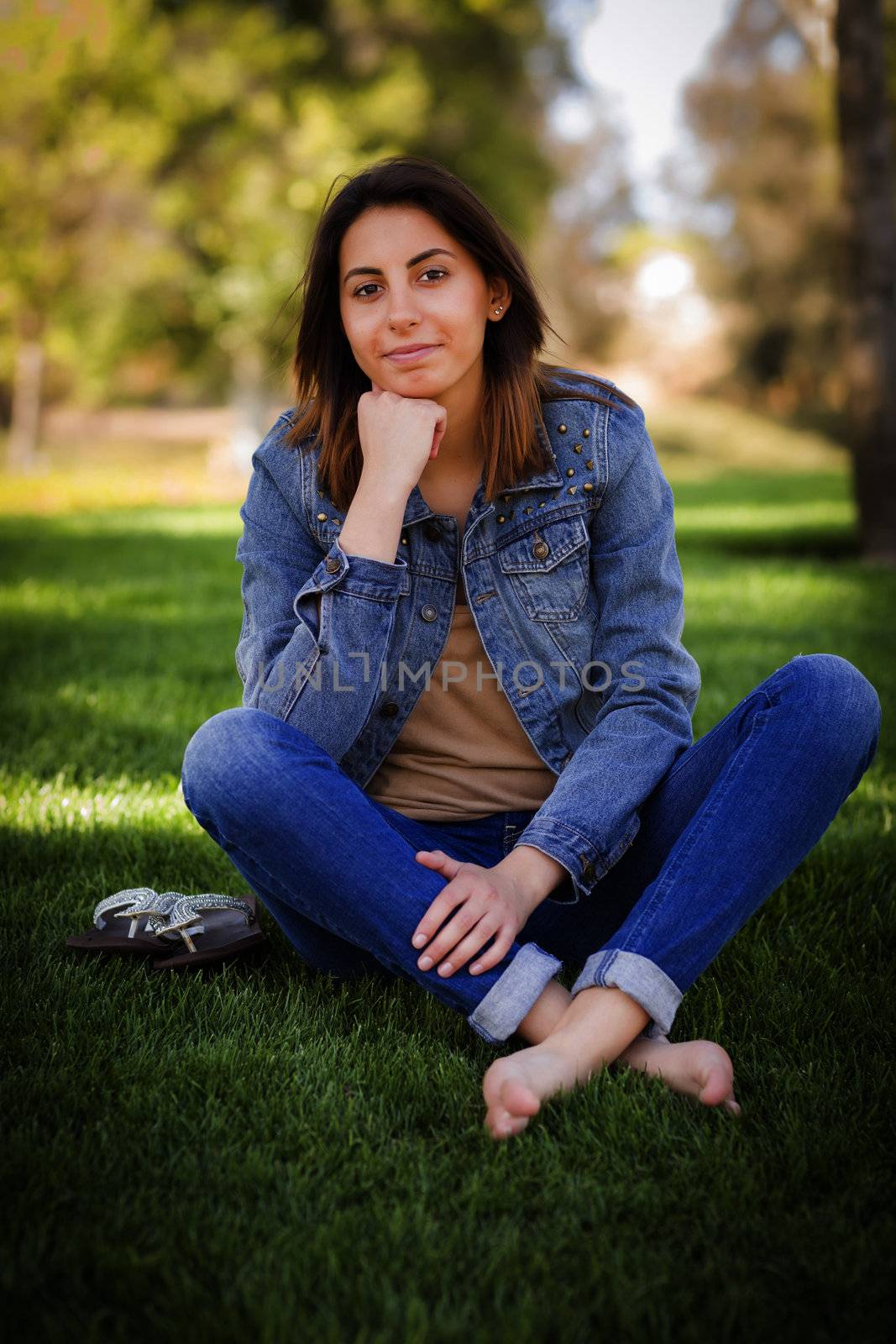 Beautiful Mixed Race Young Woman Portrait Outside In The Grass.