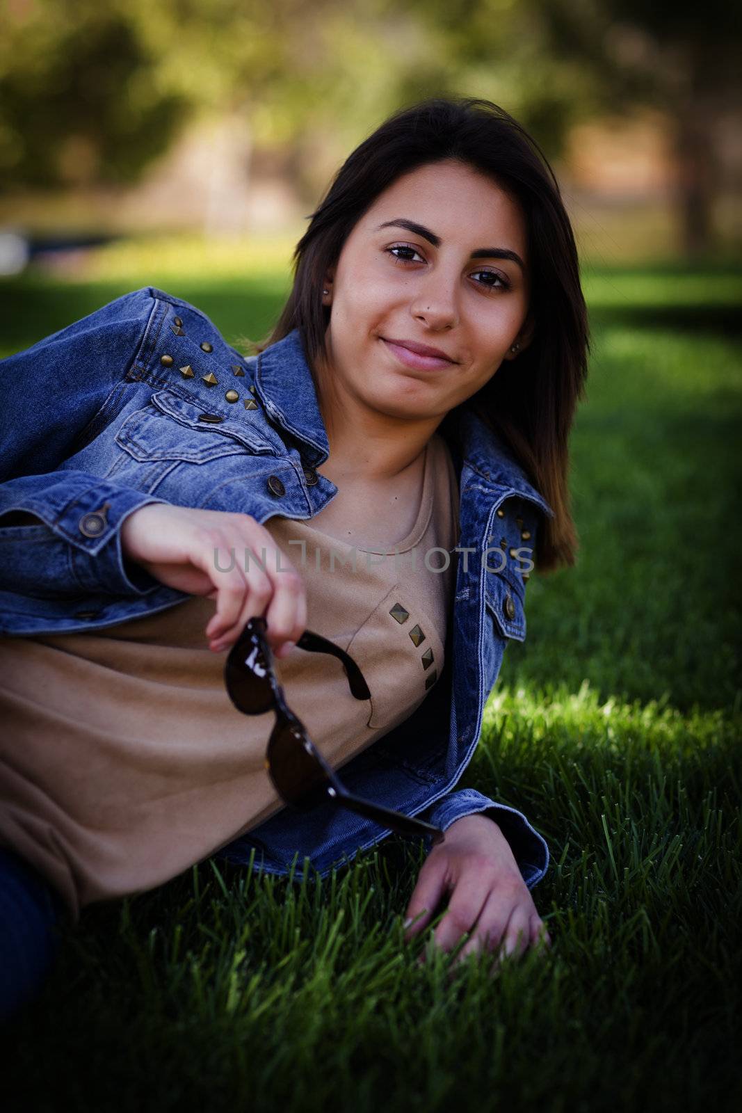 Beautiful Mixed Race Young Woman Portrait Outside In The Grass.