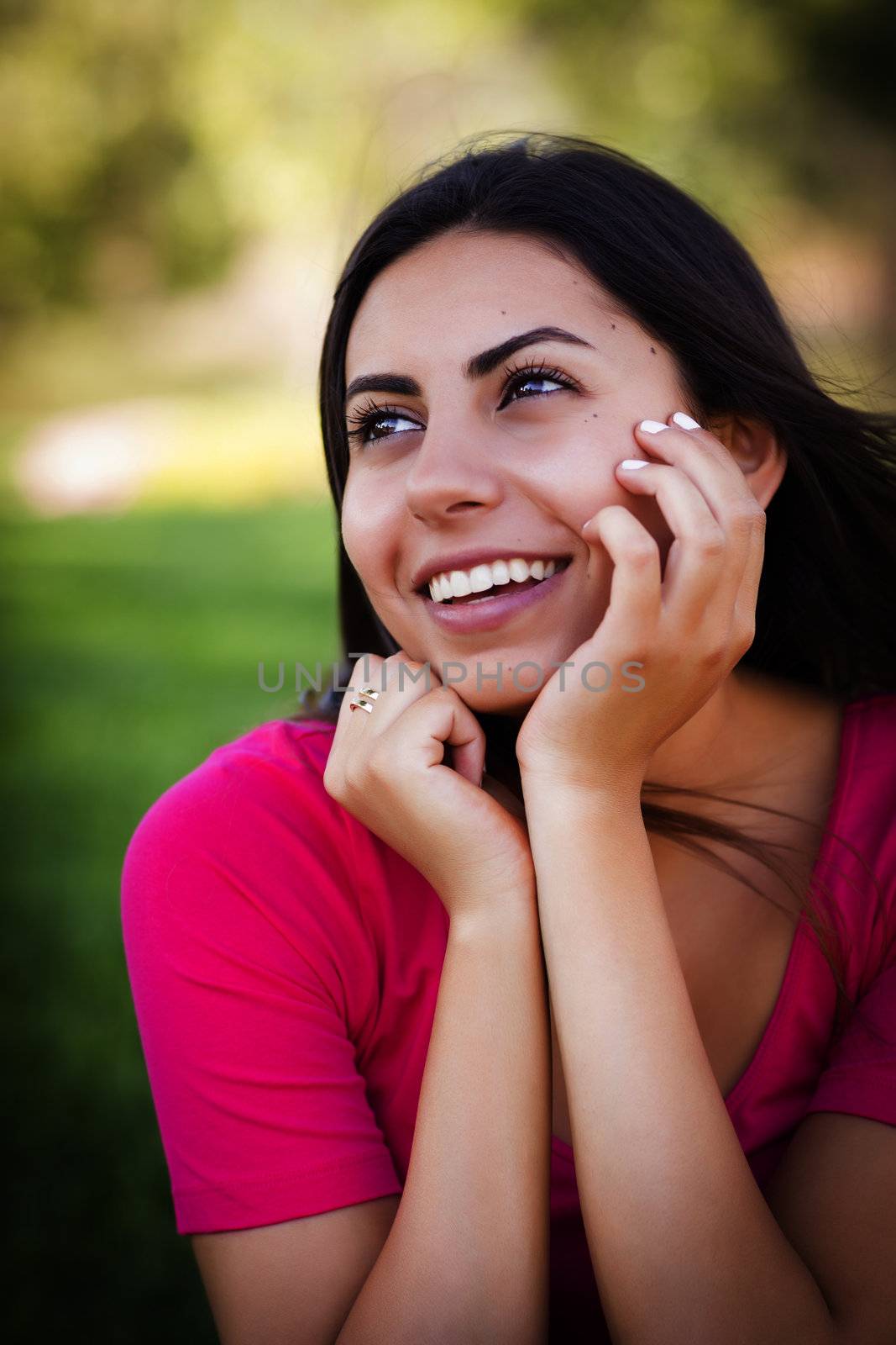 Beautiful Mixed Race Young Woman Portrait Outside In The Grass.