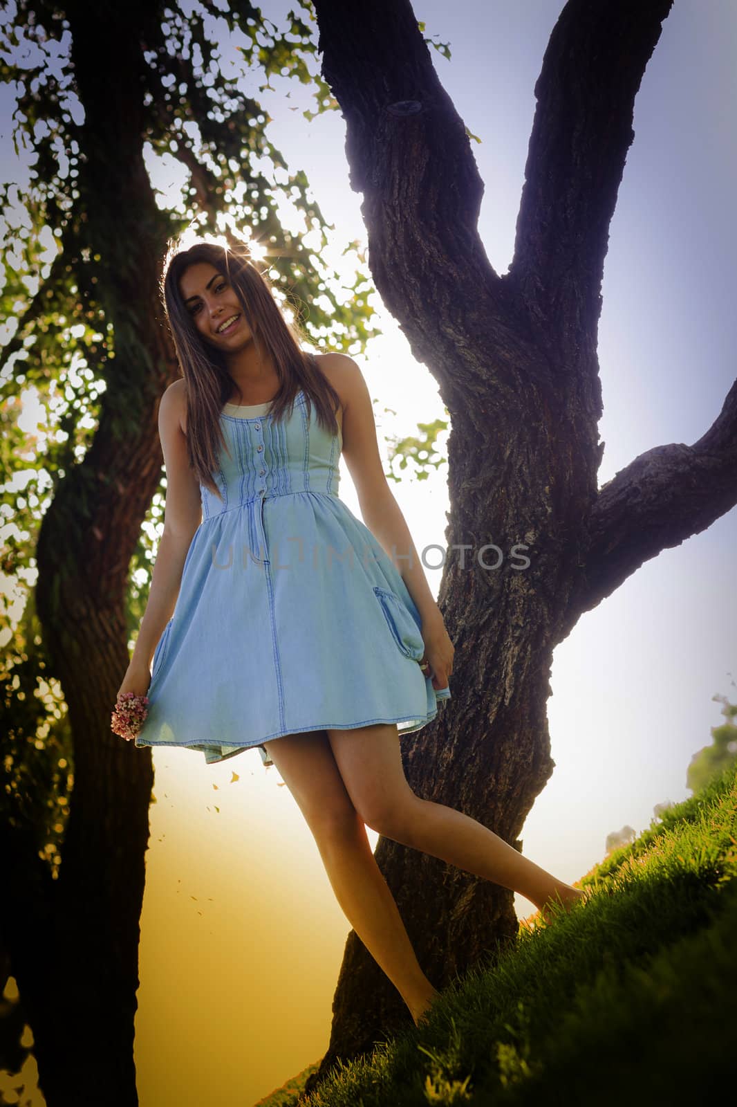 Beautiful Mixed Race Young Woman Portrait Outside In The Grass.