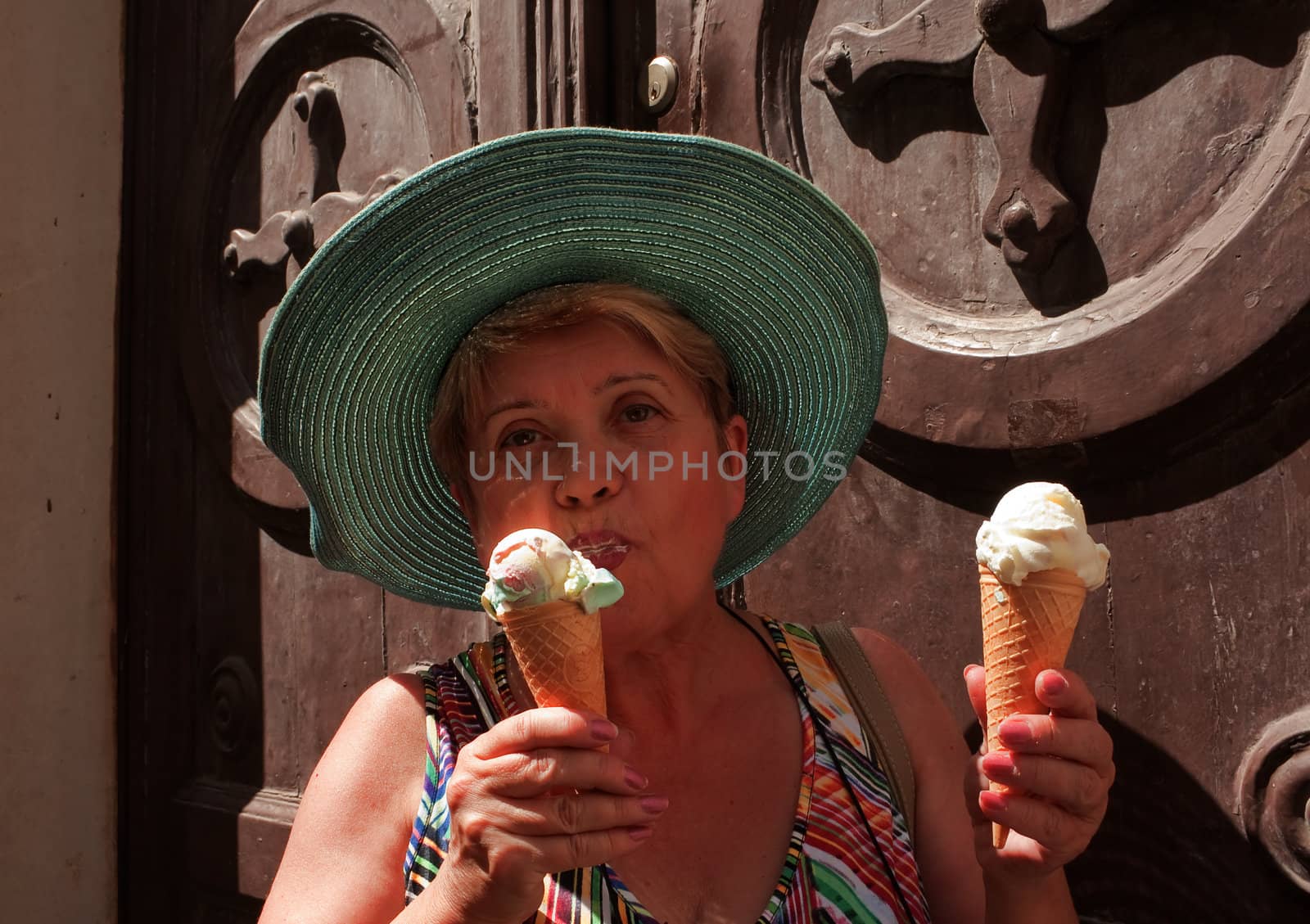 Woman eating ice cream by nikolpetr