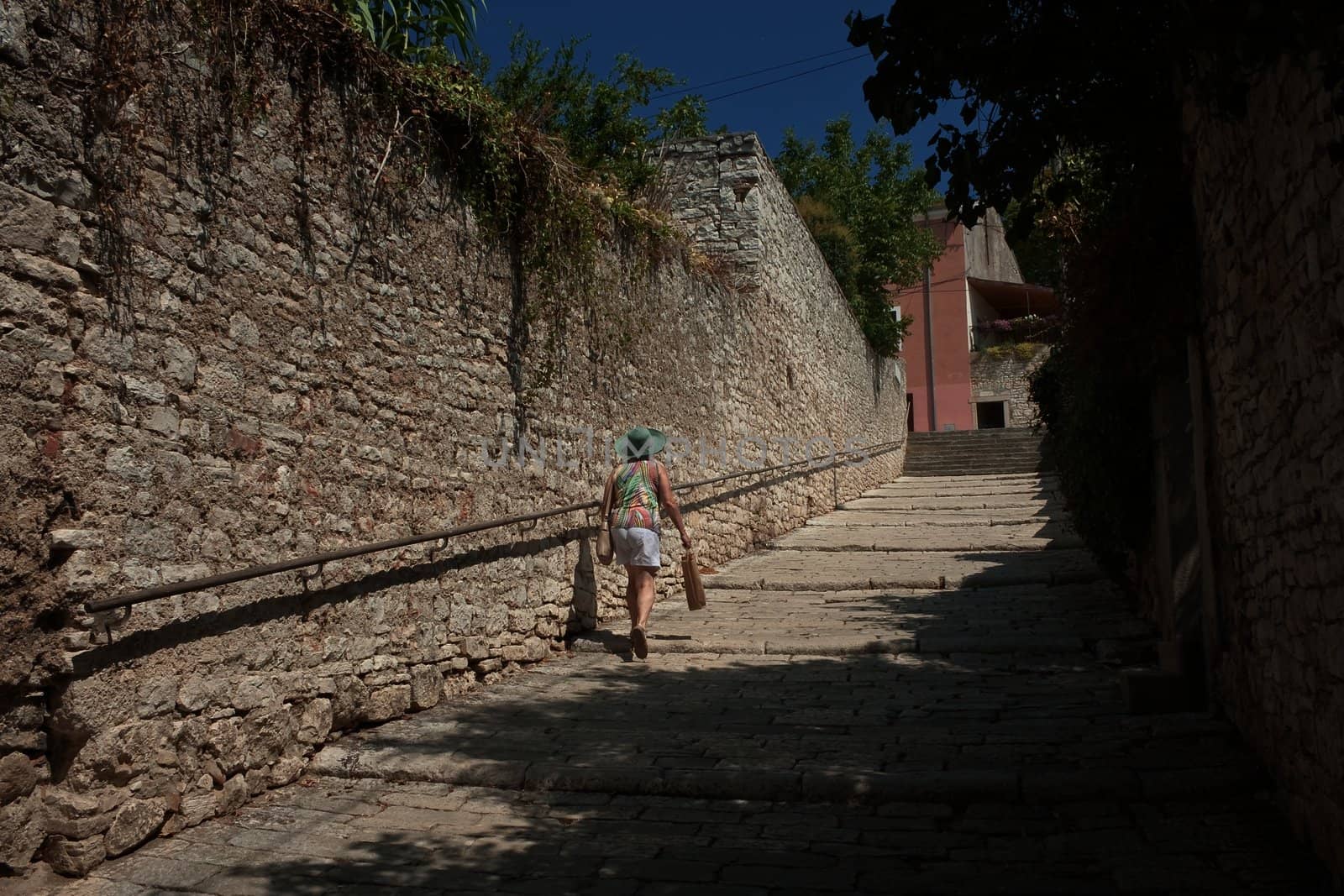 A tourist on the streets of the historic center of Pula, Croatia