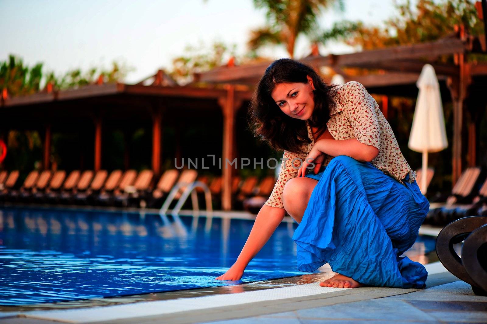 Beautiful young girl at the pool