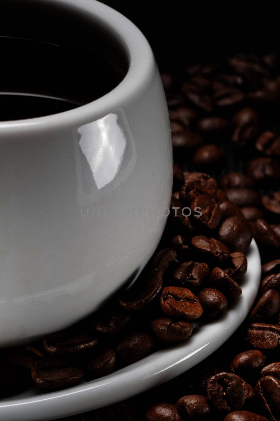 A cup of coffee on a background coffee grains