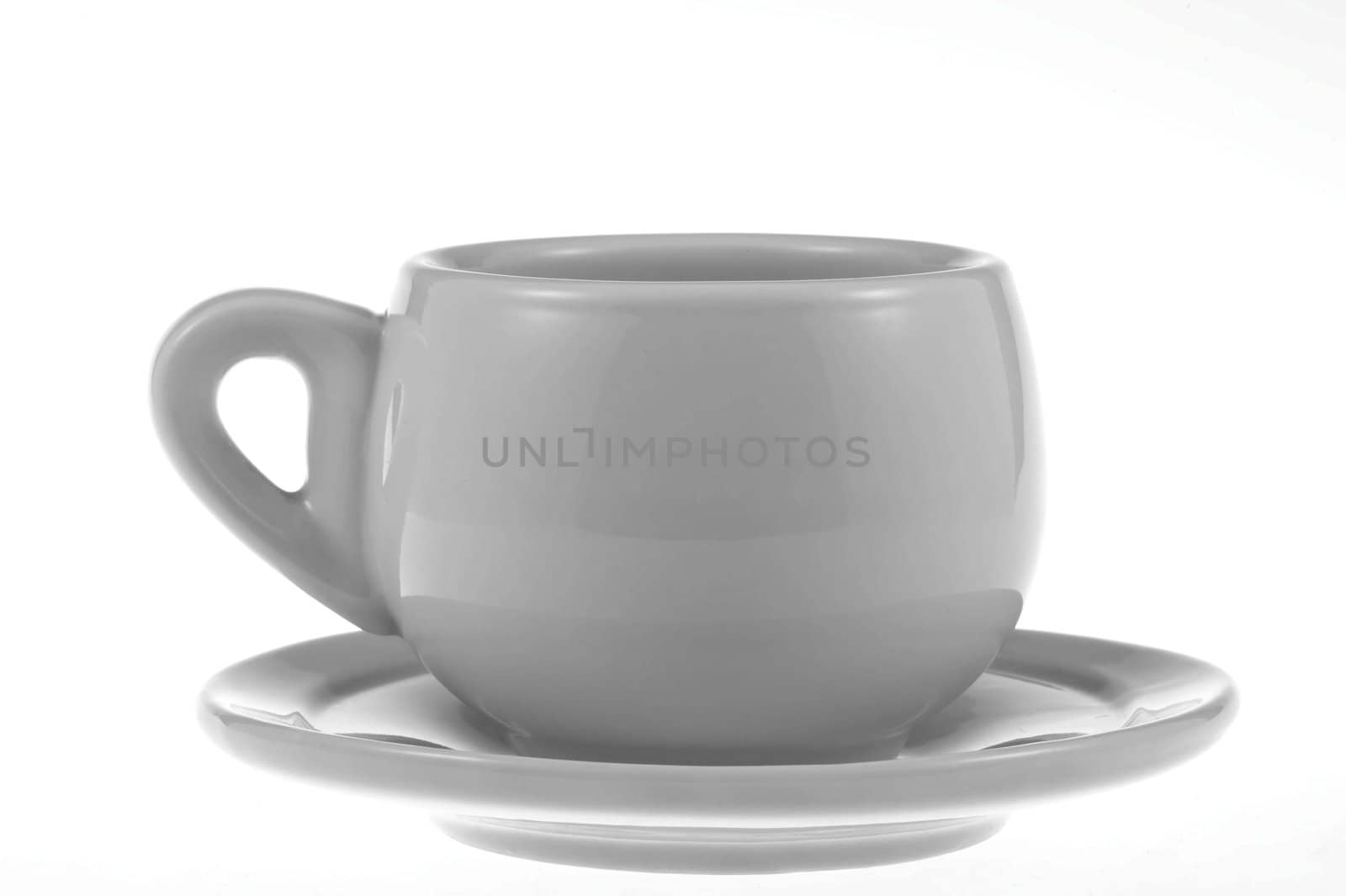 White porcelain cup and saucer on a white background