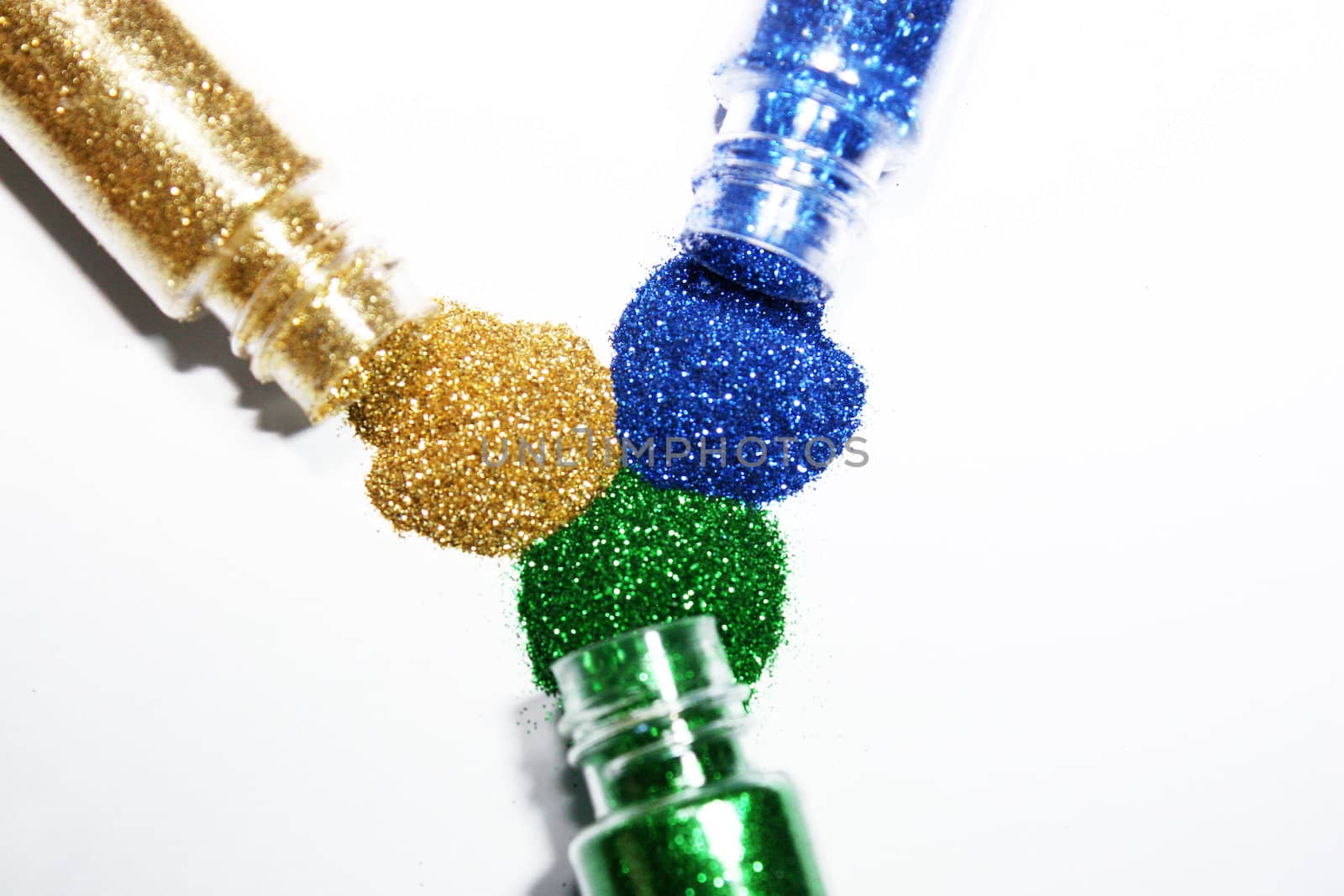 Colored glitter powder coming out form bottles