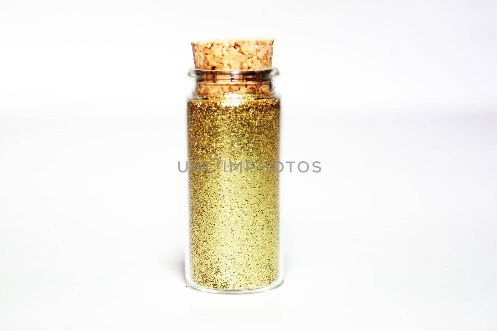 Gold glitter powder in a glass small bottle