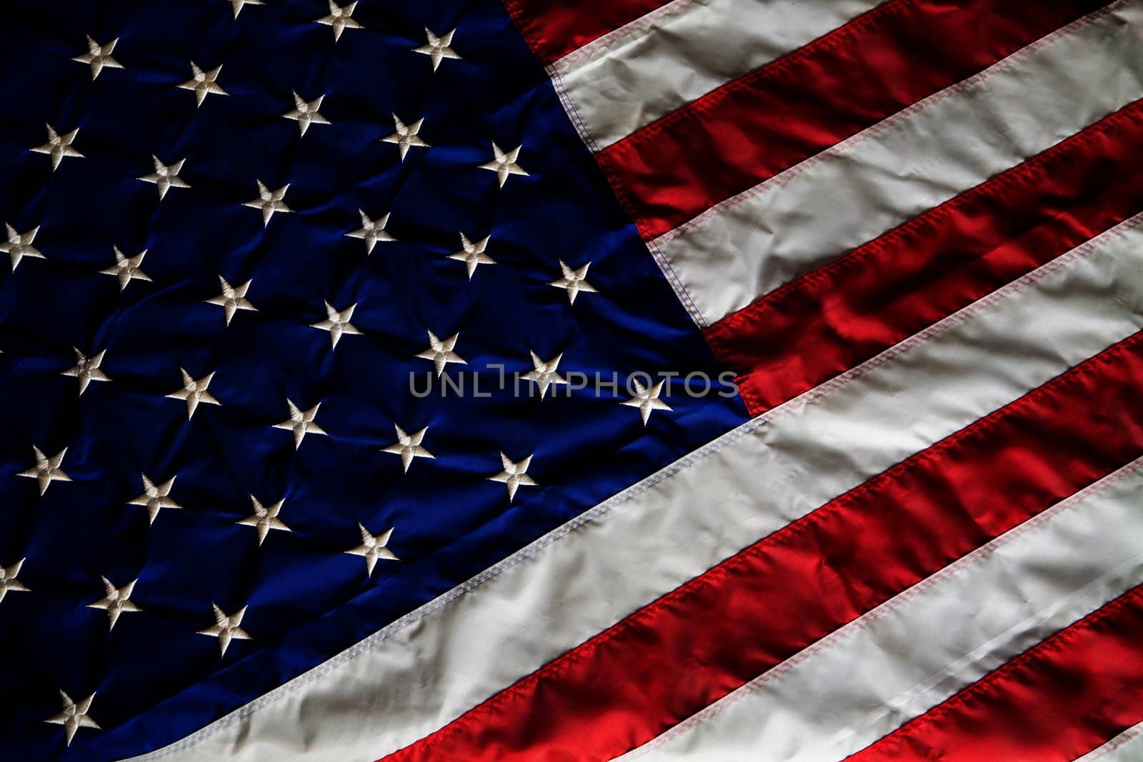 Crumpled, vintage American flag. Real photo. Closeup.