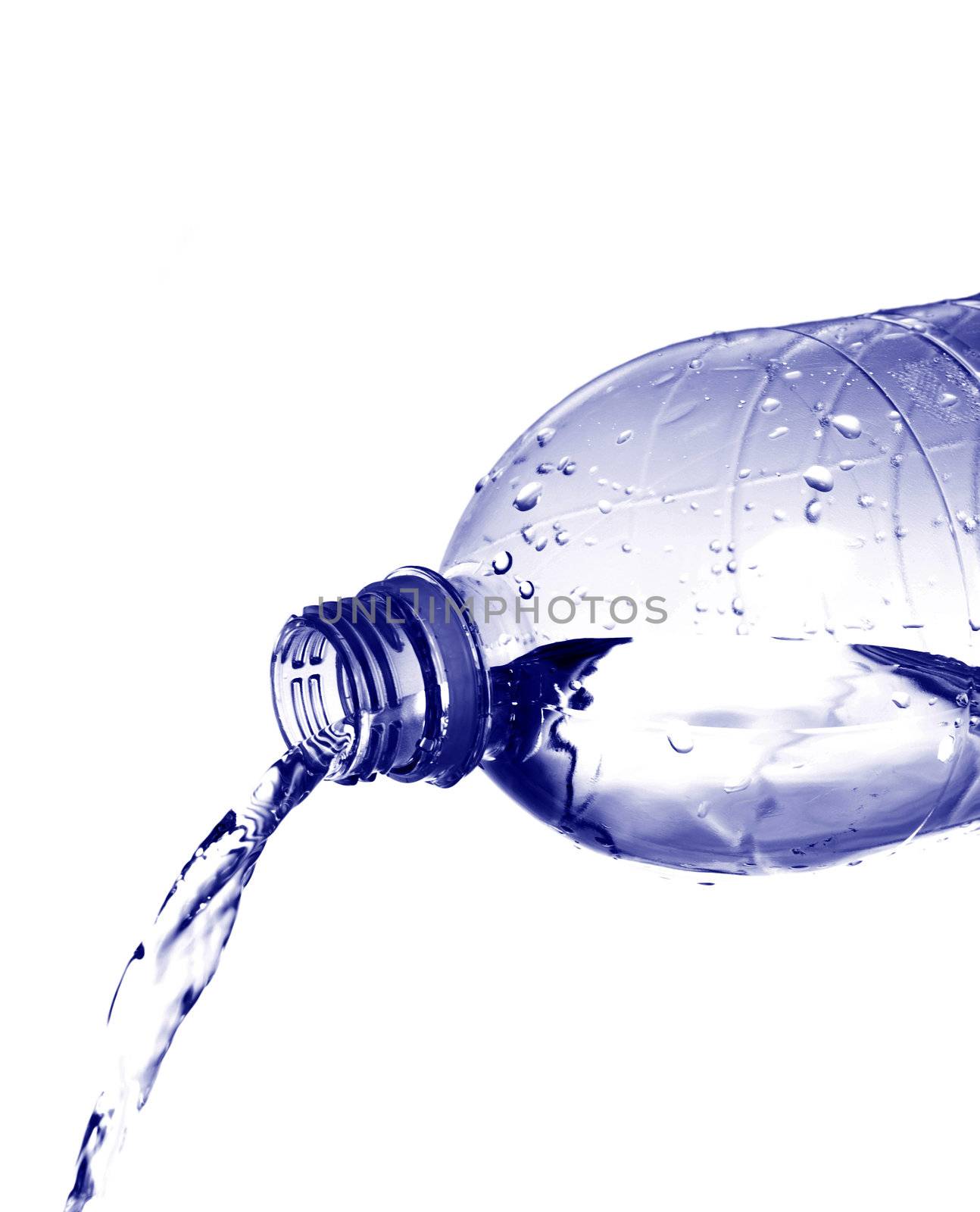 Water pours from a plastic bottle isolated on white background