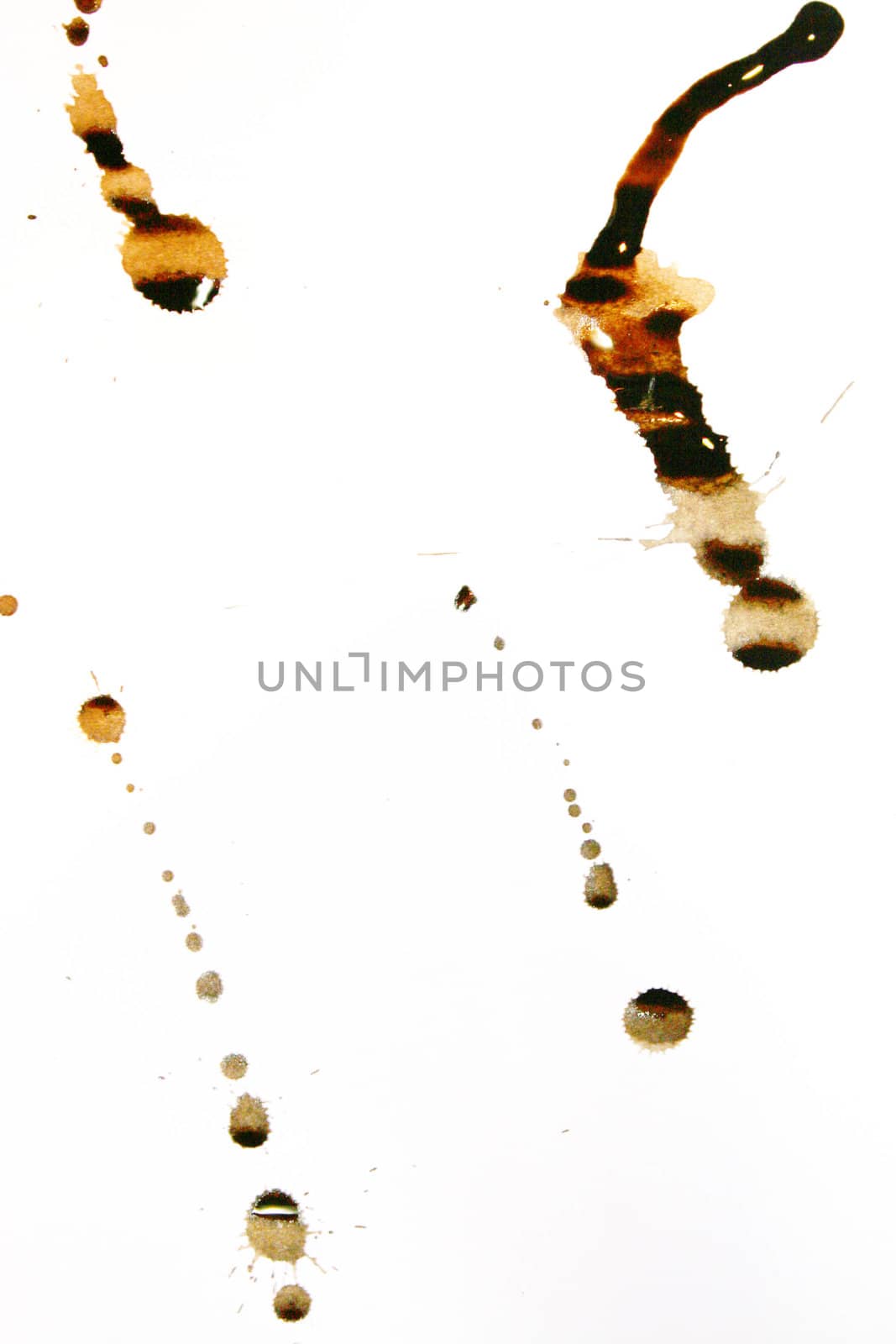 Sepia color ink stains on a white paper sheet by valentinacarpin
