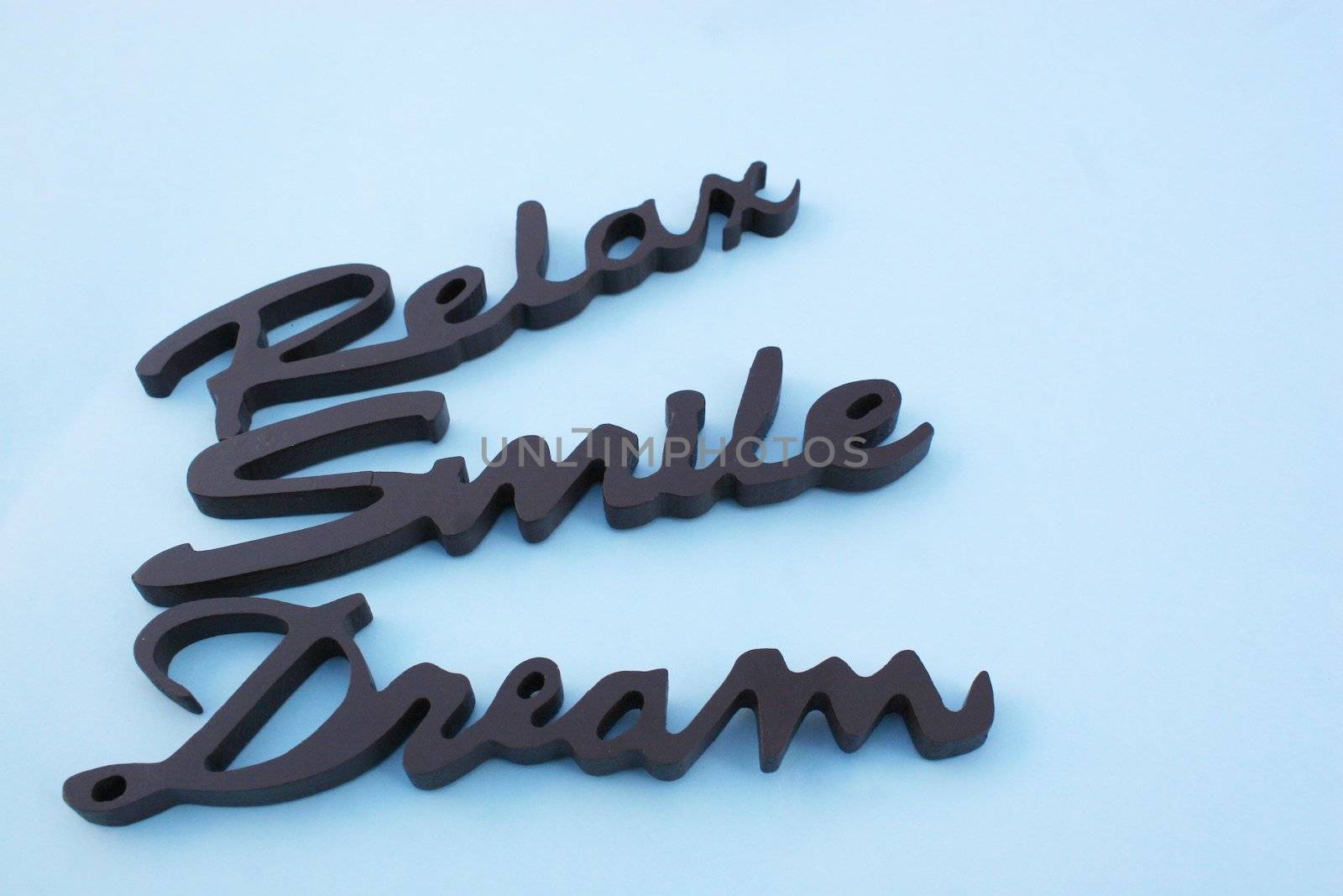 Close up of the word dream on a white background