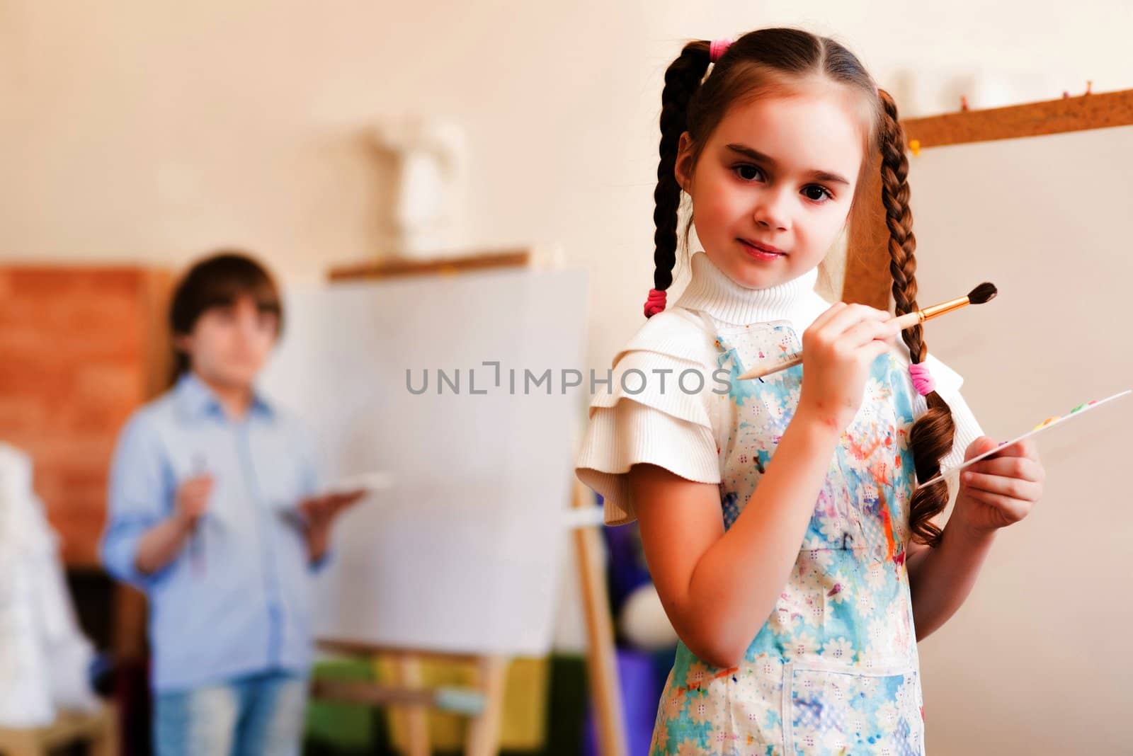 portrait of a girl standing next to his easel, a drawing lesson