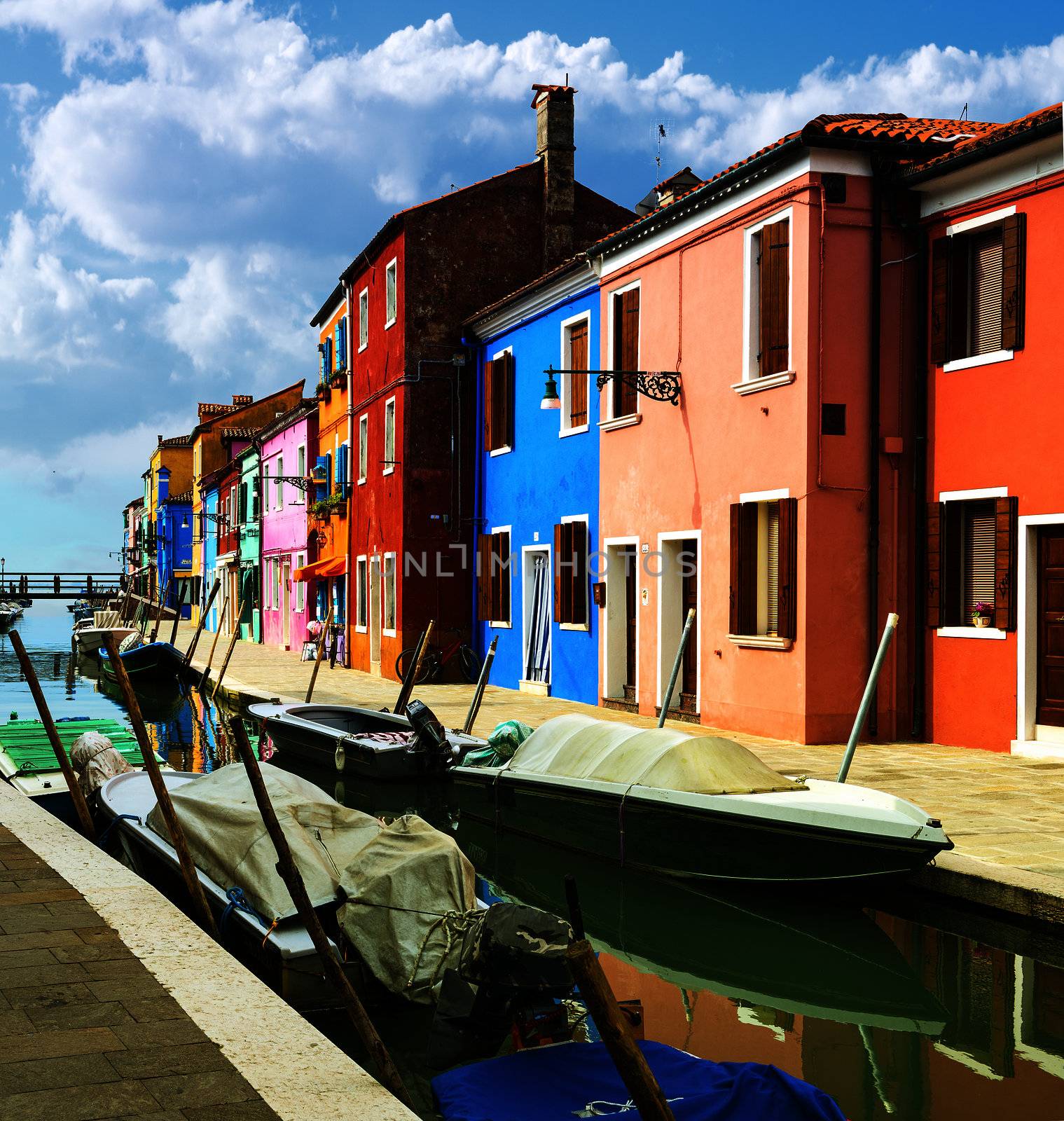 Colorful buildings in Burano island sunny street, Venise, Italy