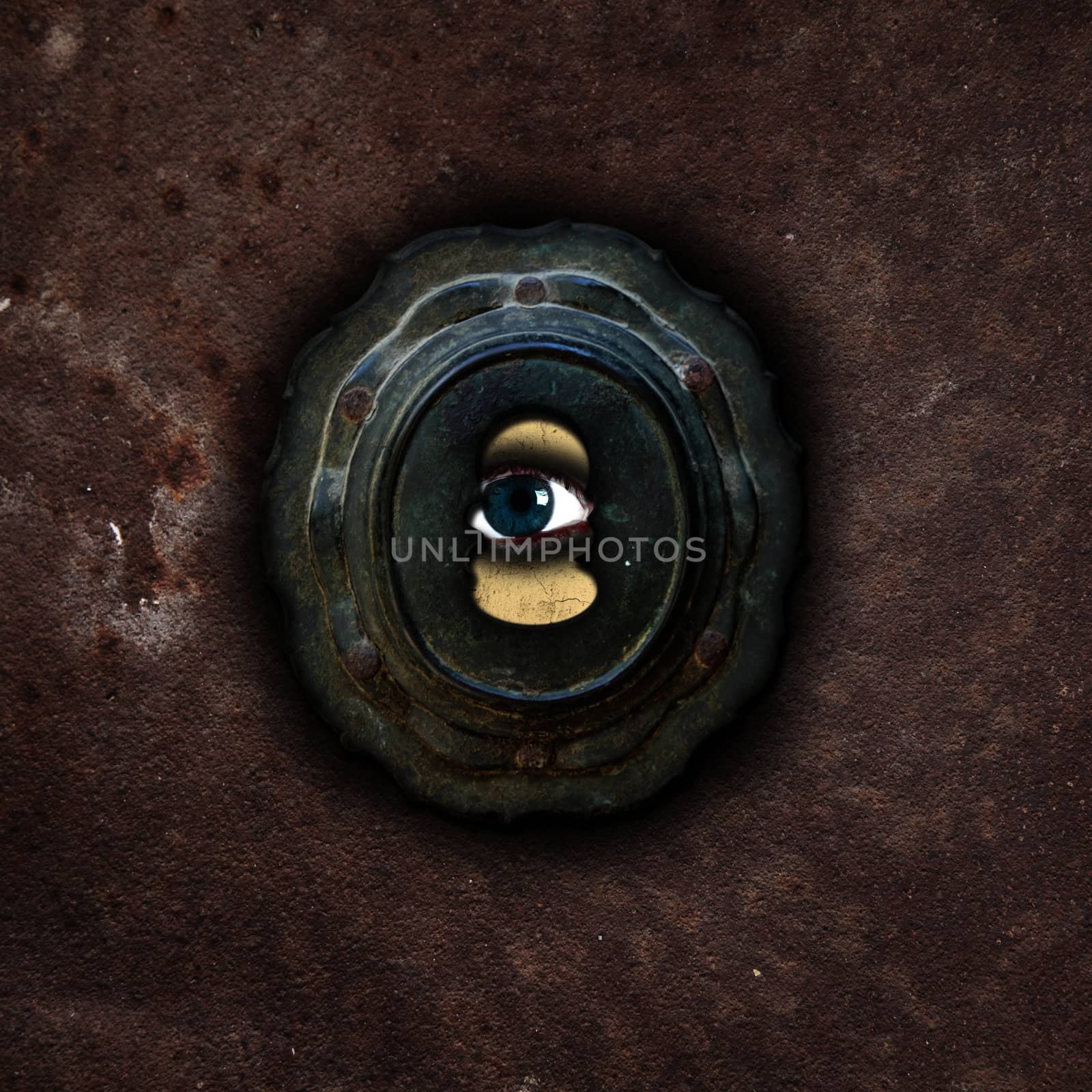 a human eye peering through a keyhole