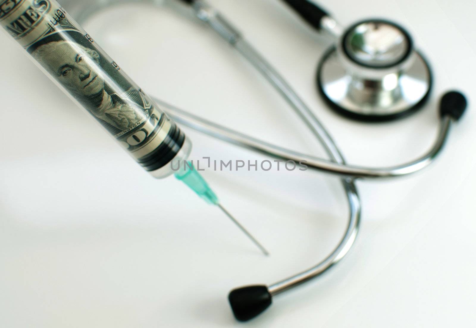 Injection needle consisting of dollar banknotes with a medical stethoscope