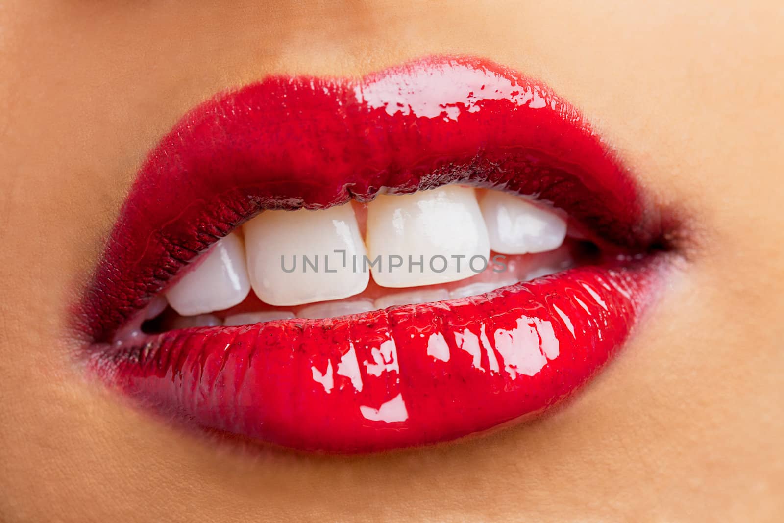 woman lips wearing red shiny lipstick by kozzi