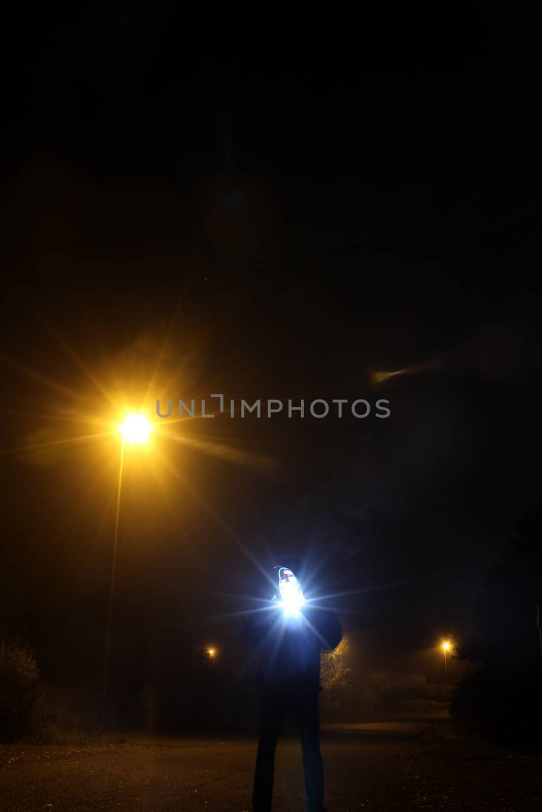 guy at night with mobile strobe unit by Teka77