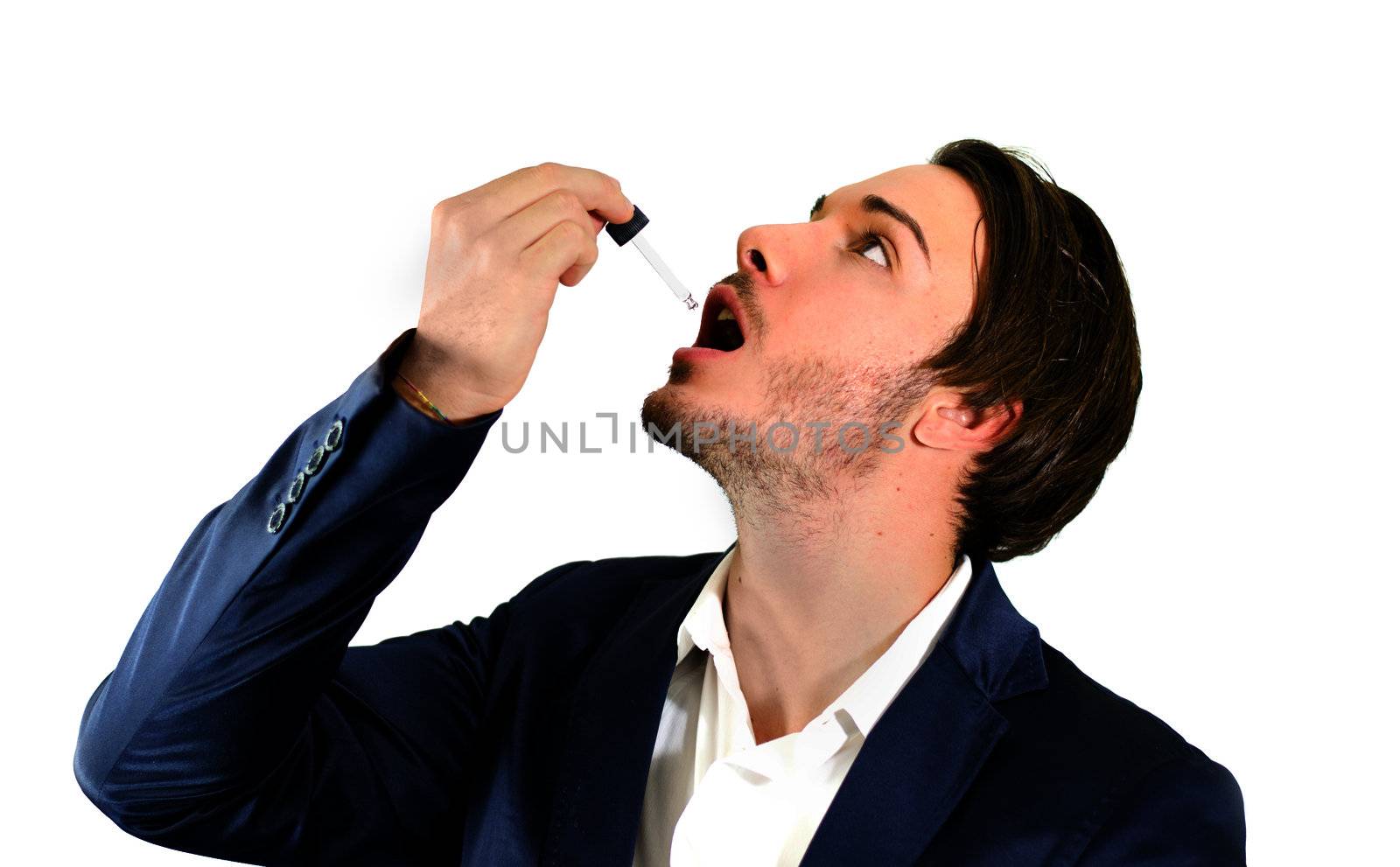 Young man using dropper pipette on his mouth for medicine, drug treatment