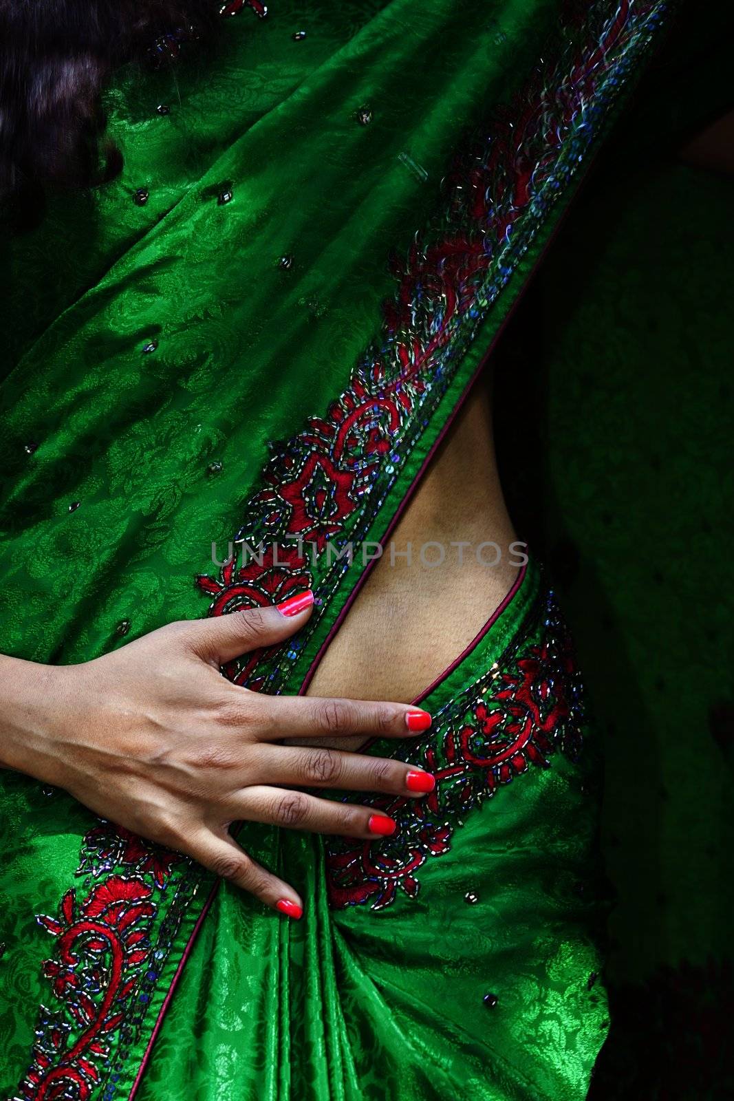 closeup of a beautiful indian woman in a saree by bernjuer