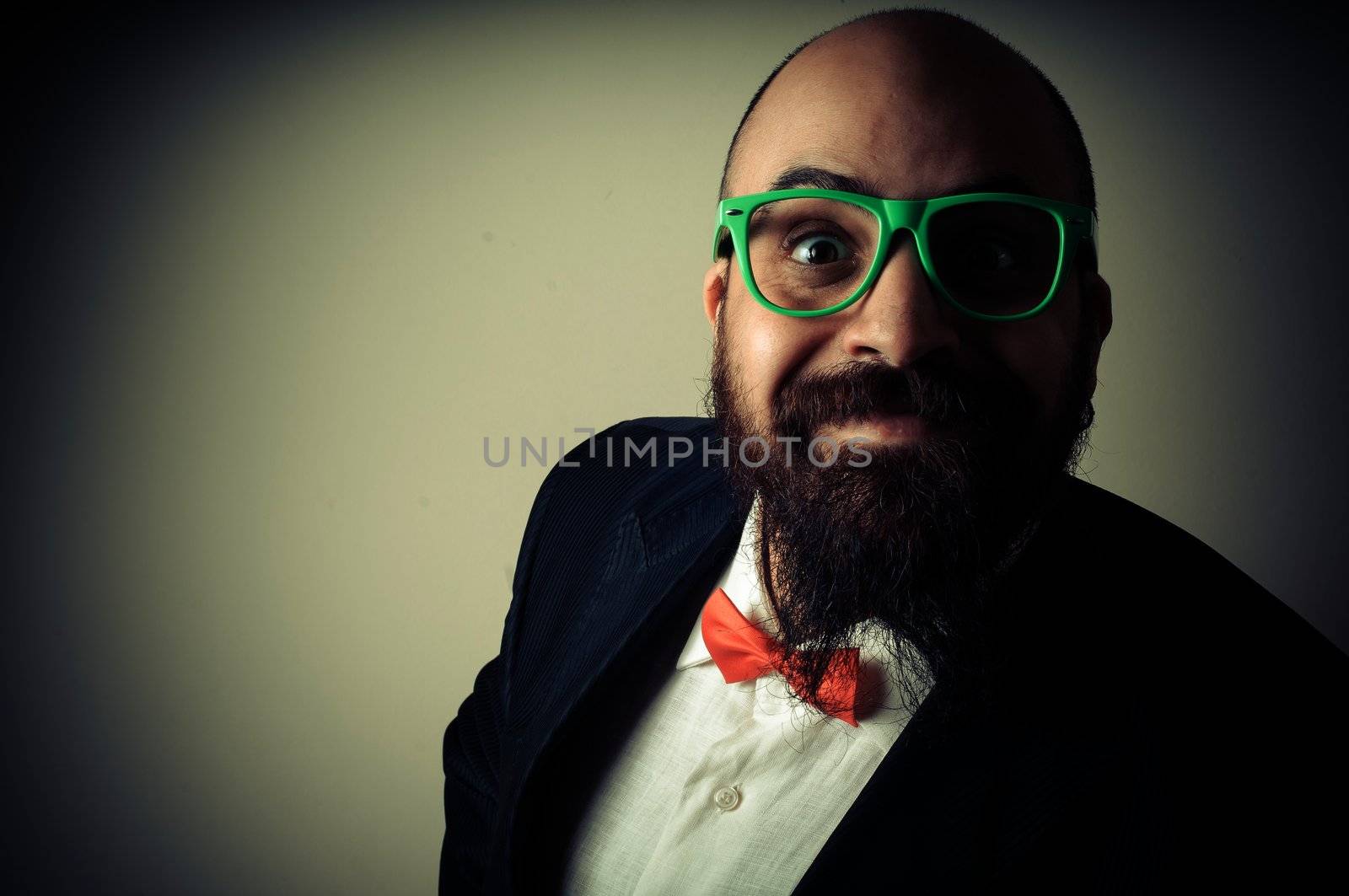  funny elegant bearded man on vignetting background
