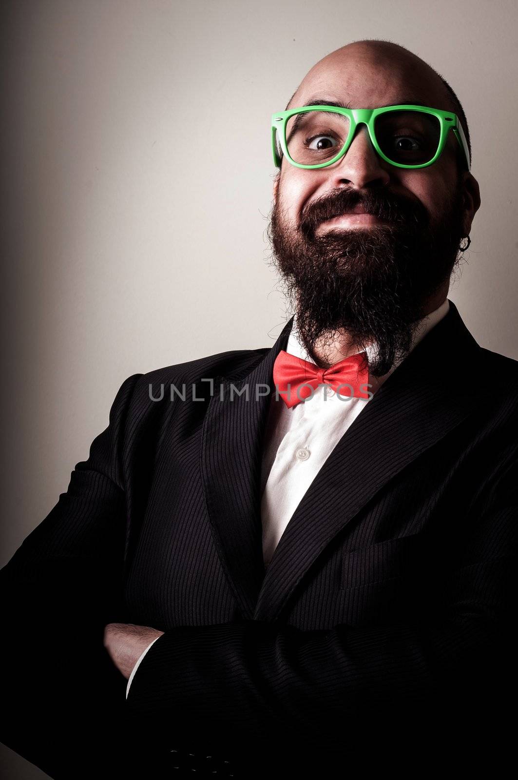  funny elegant bearded man on vignetting background