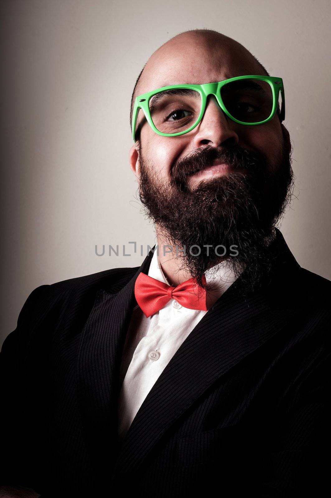  funny elegant bearded man on vignetting background