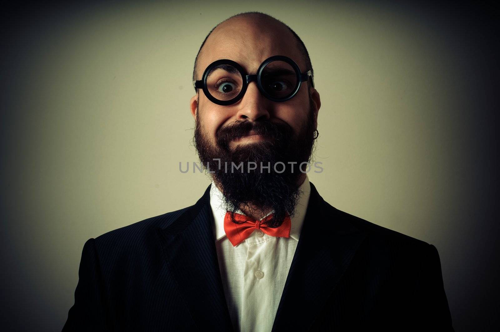  funny elegant bearded man on vignetting background