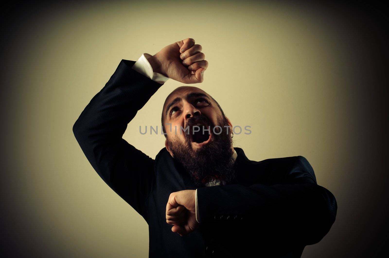 funny afraid elegant bearded man on vignetting background