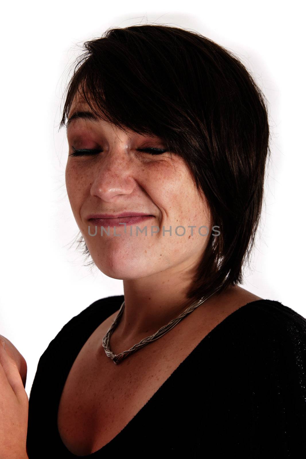 variation of expression on the face of a young brunette woman in studio with a colored scarf