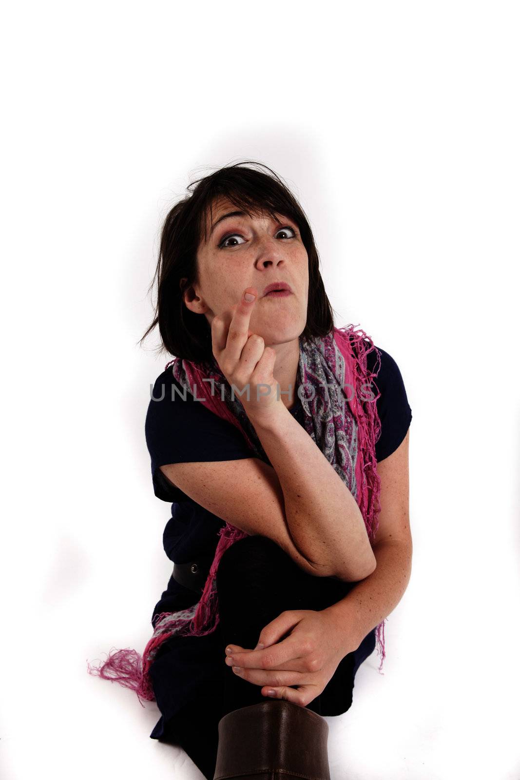 variation portrait of a young brunette woman with colored scraf on studio with her hand under her mounth