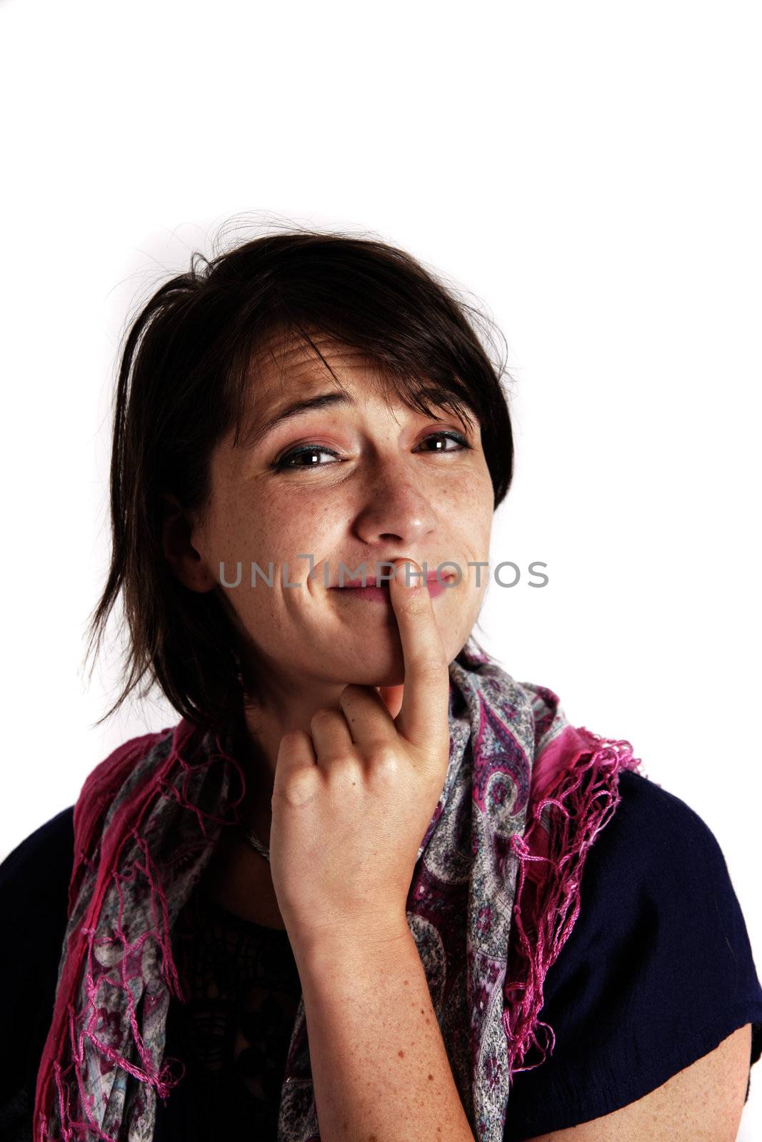 humorous portrait of a young brunette woman with finger of her mouth, colored scarf