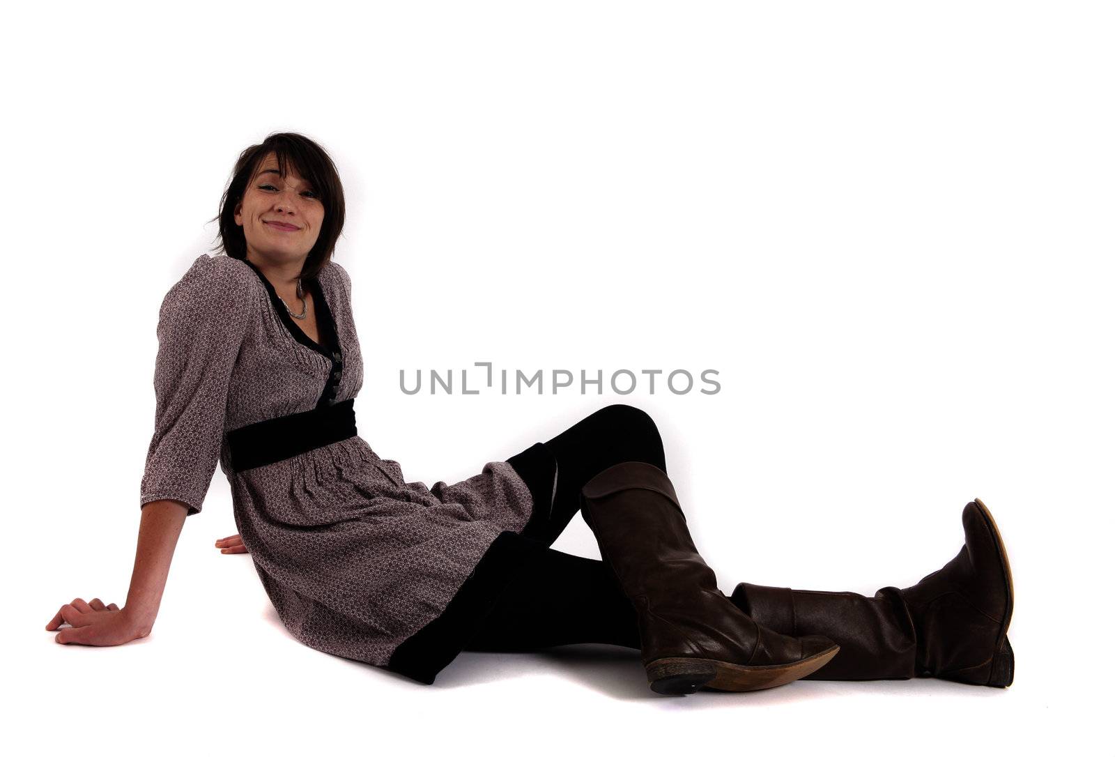 young woman sitting on the ground in boots by macintox