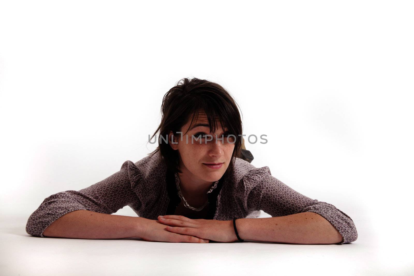 young brunette woman lenthened on the ground isolated in studio by macintox