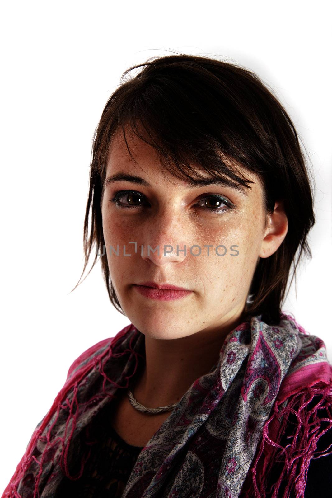 portrait of a young brunette woman with colored scarf looking ahead