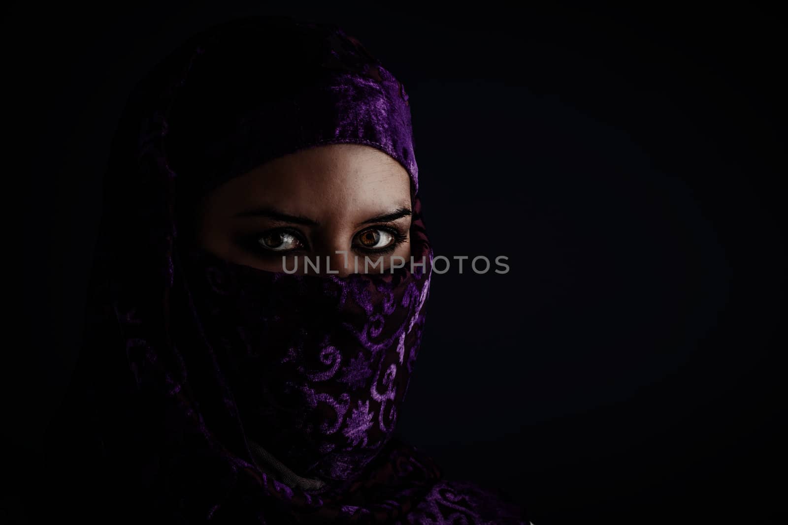 Arab women with traditional veil, eyes intense, mystical beauty
