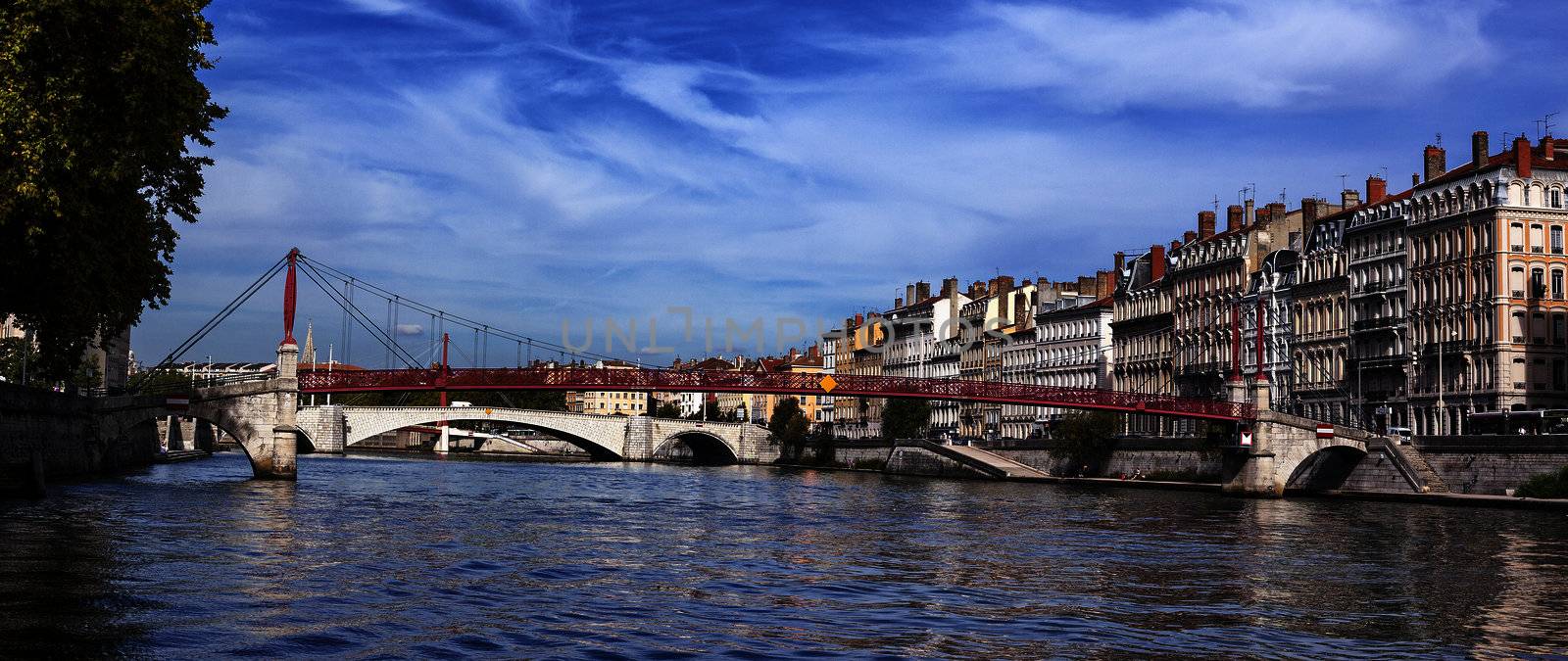 Panoramic view of Lyon with Saone river and famous red footbridge