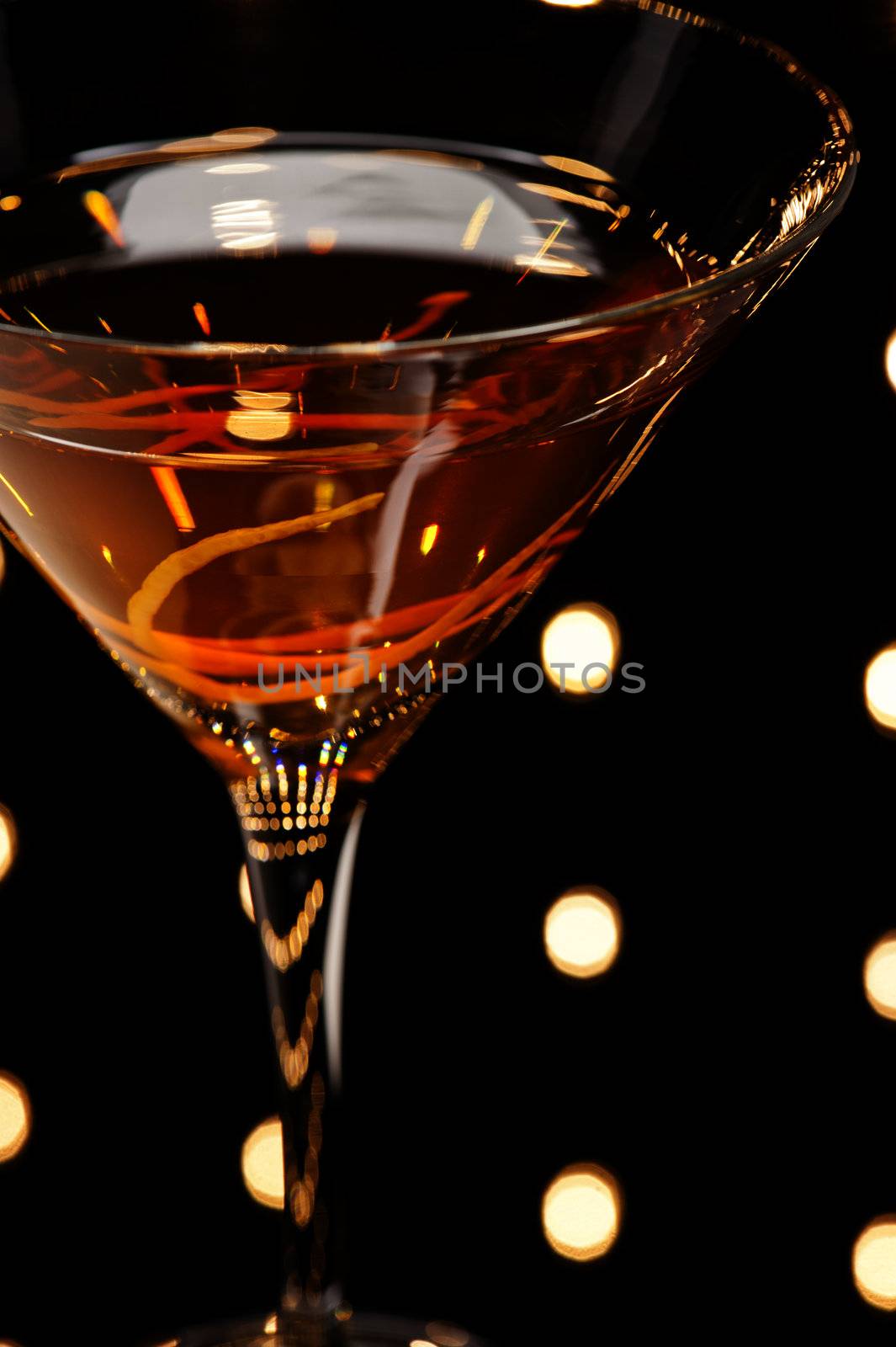 Manhattan cocktail in front of disco lights