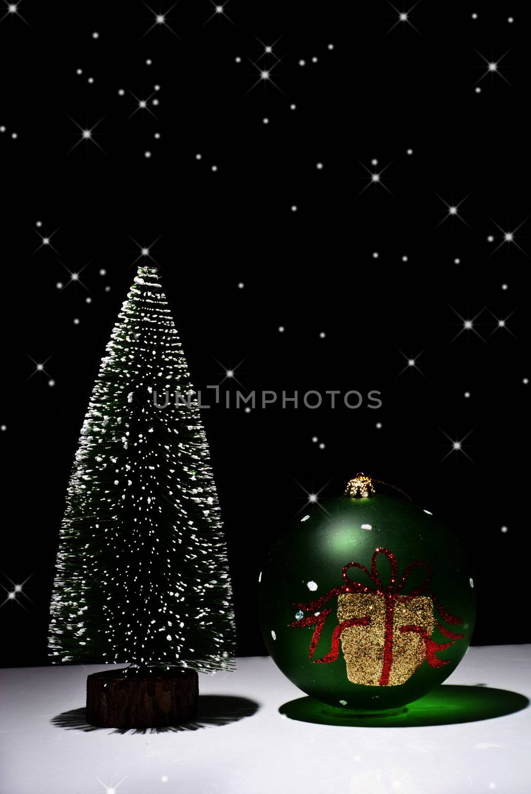 Christmas Tree and Christmas ball on a black background with stars