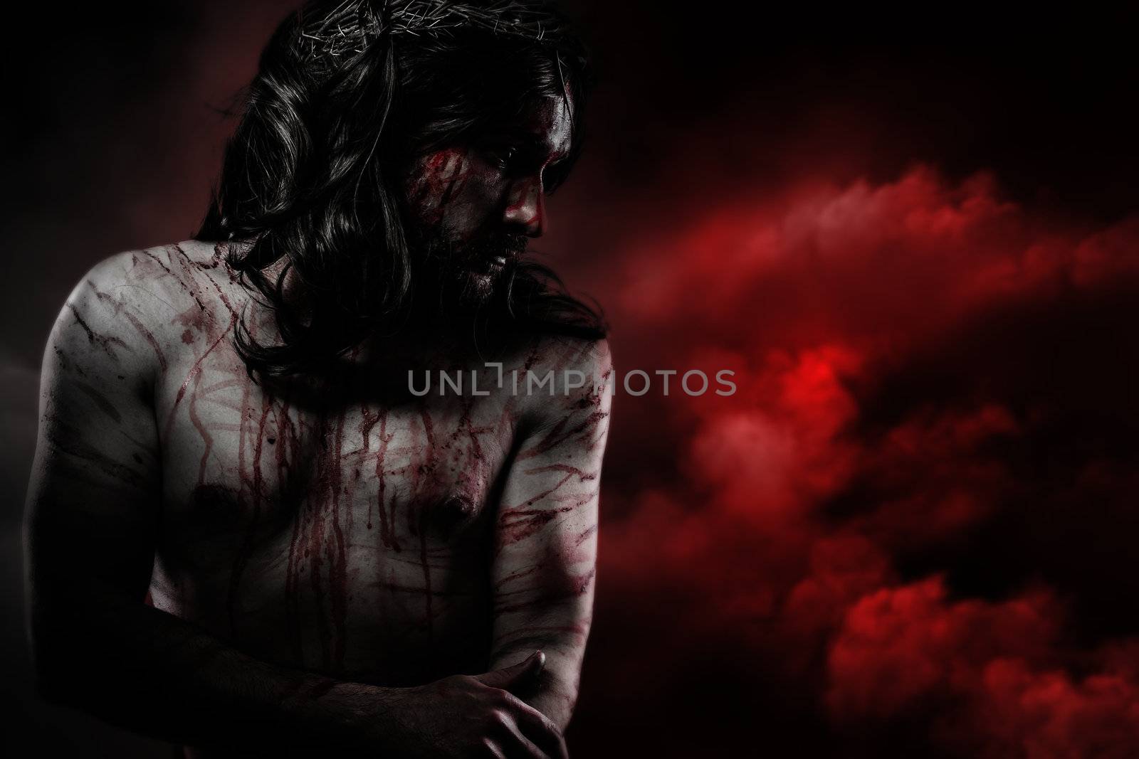 Jesus Christ over red cloudscape, calvary concept