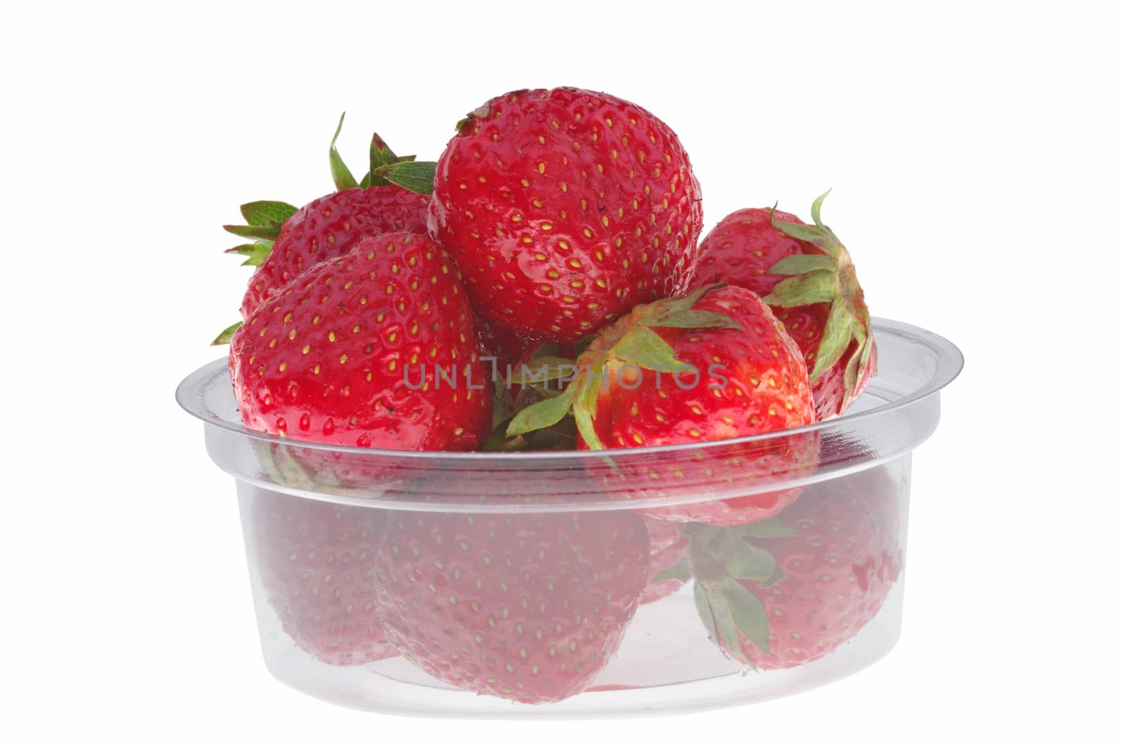 Transparent plastic box with strawberry, isolated on white
